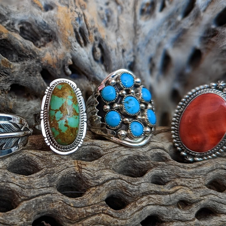 a collection of native american made rings
