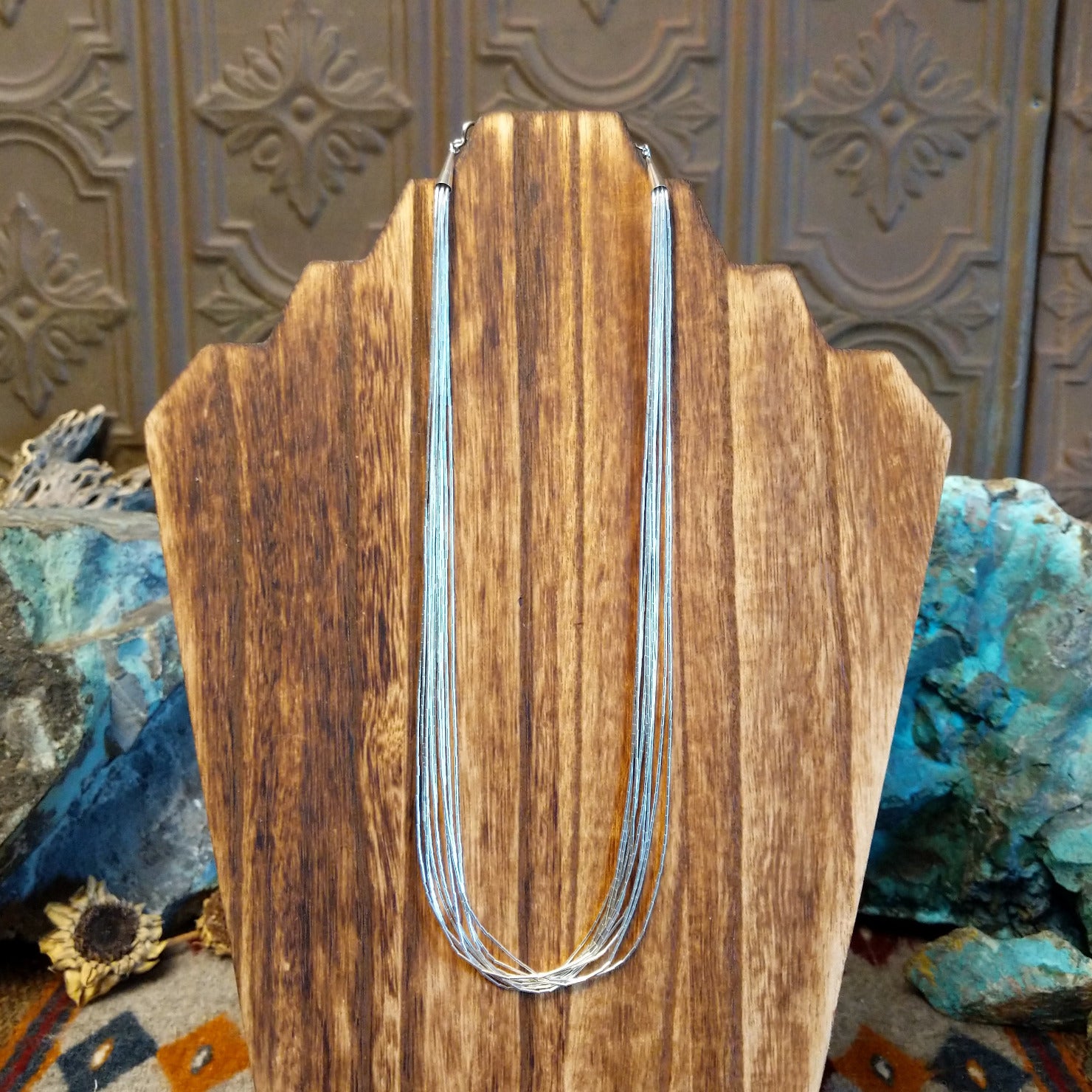 Ten strands of sterling silver beaded together used to create the necklace.
