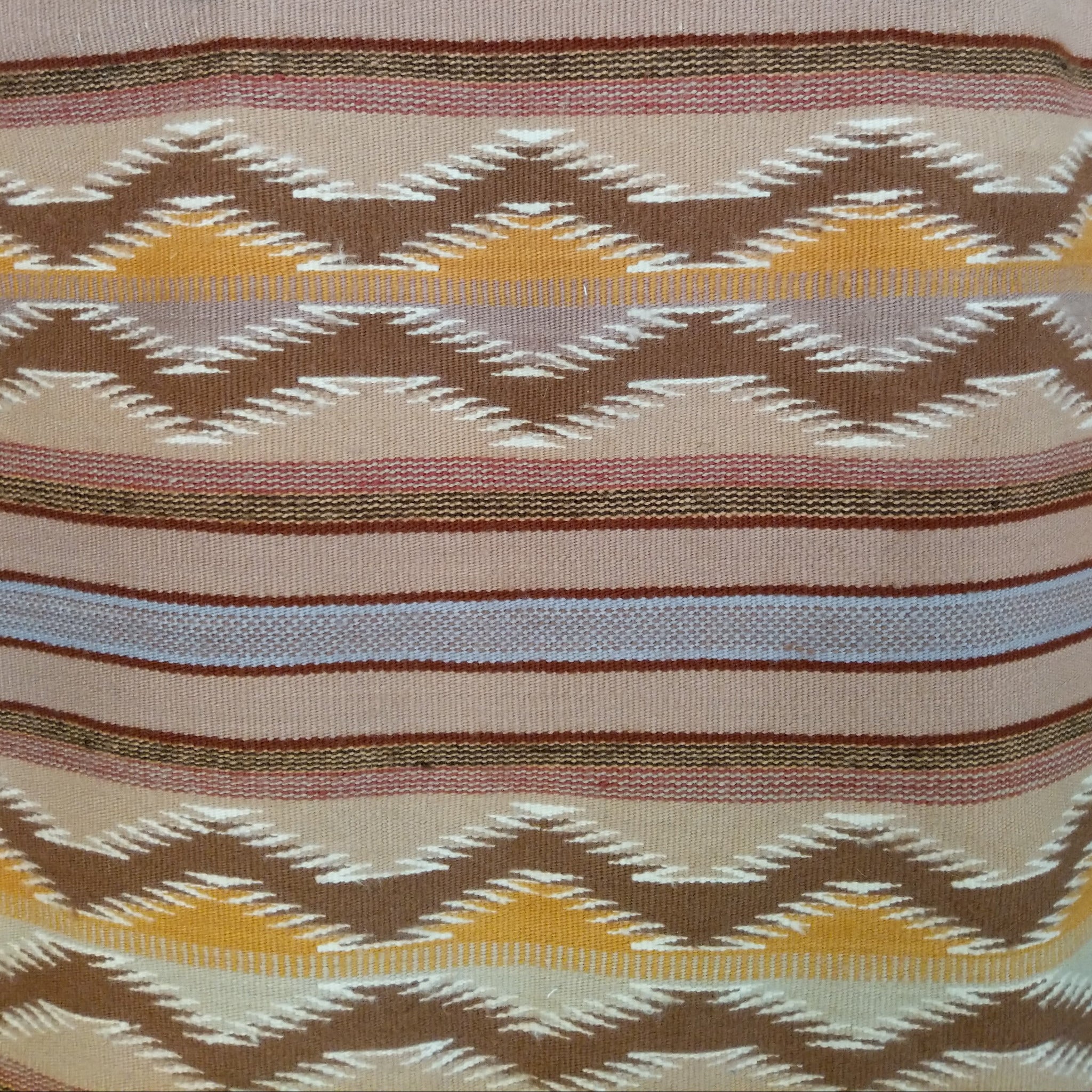 Wide Ruins Navajo Rug features alternating vertical stripes and elongated diamond motifs in soft earth tones