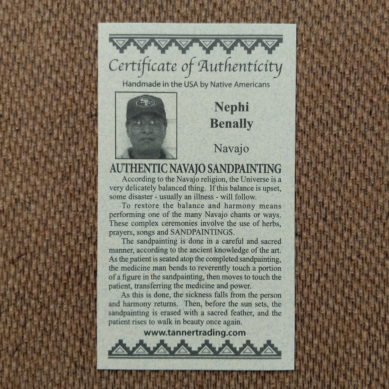 Close up of the Certificate of Authenticity and Artist information.