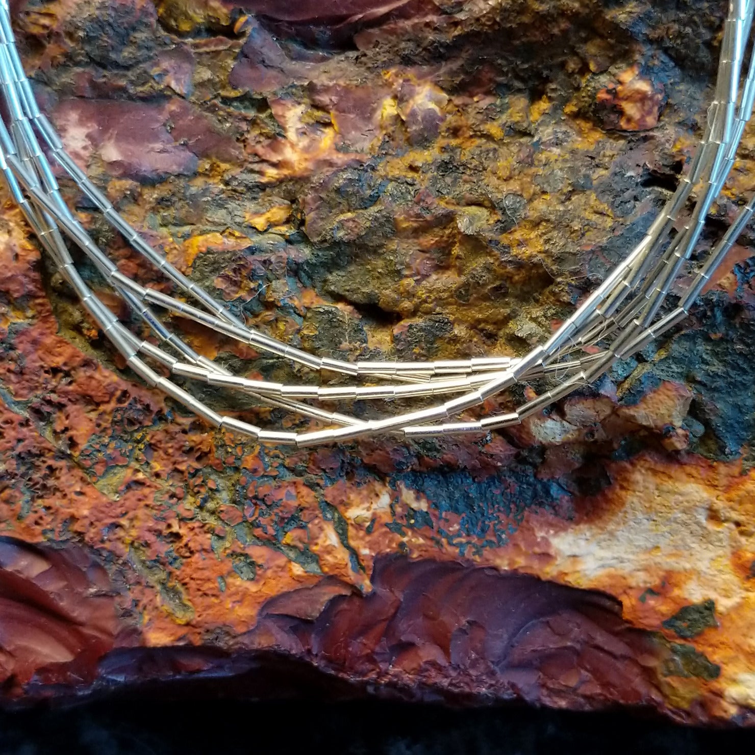 Five strands of sterling silver beaded together to create the bracelet.