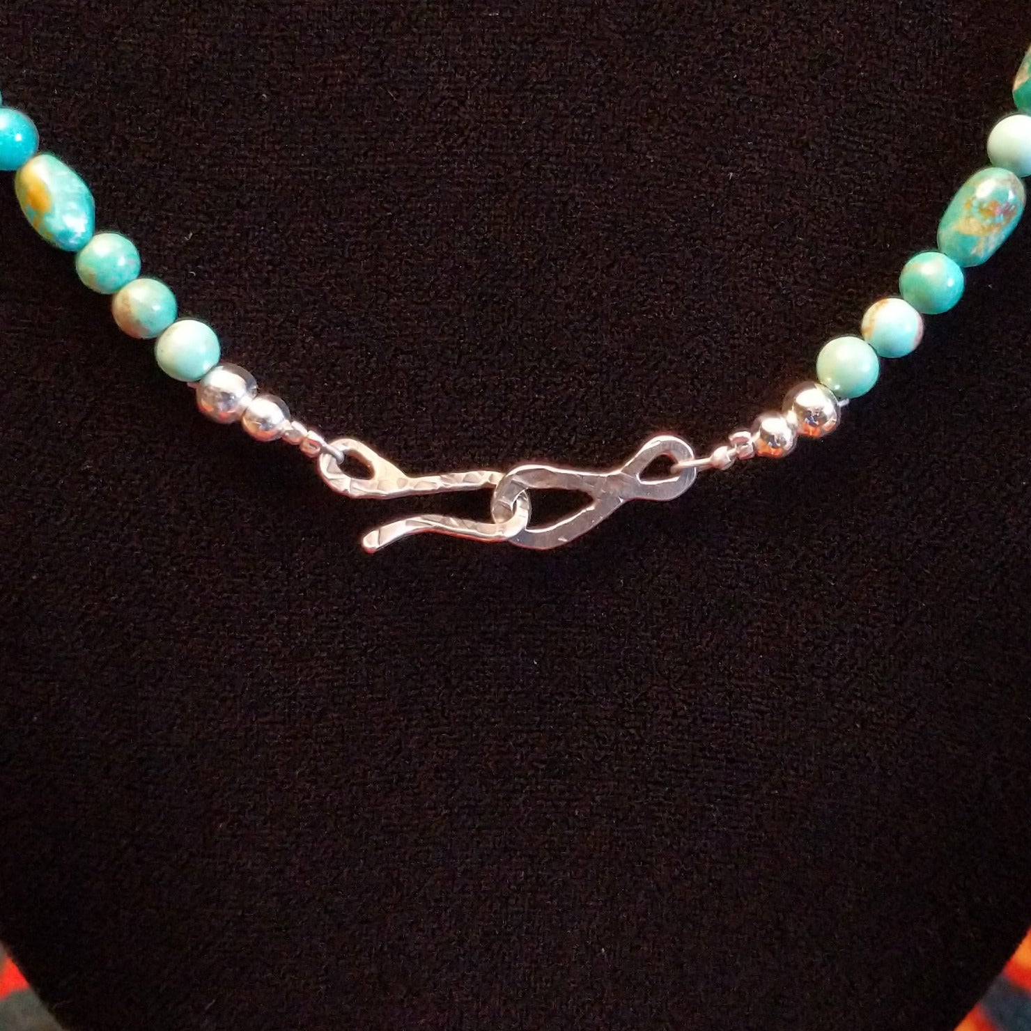 Close-up of the hook clasp on the necklace.