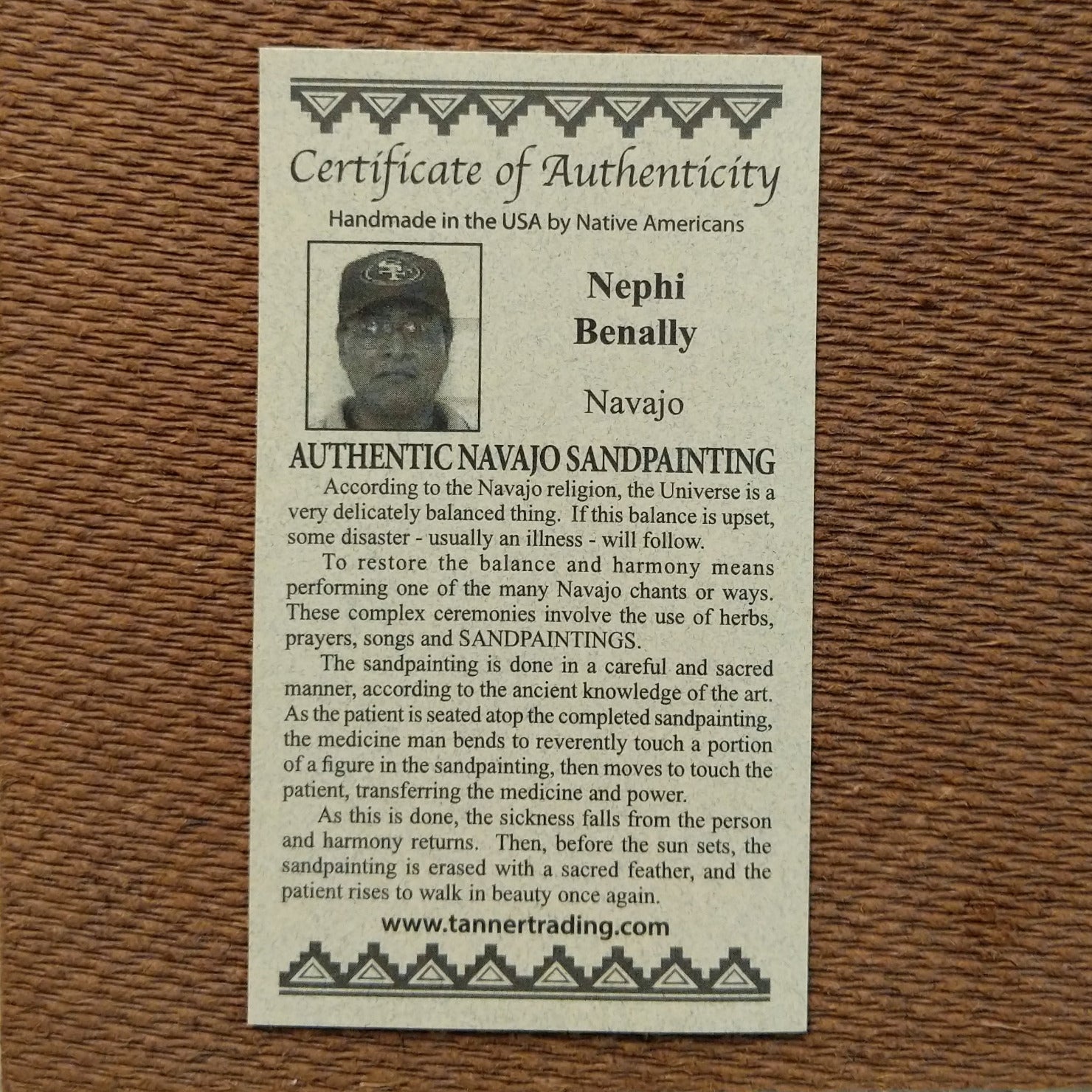 Close up of the Certificate of Authenticity and Artist information.