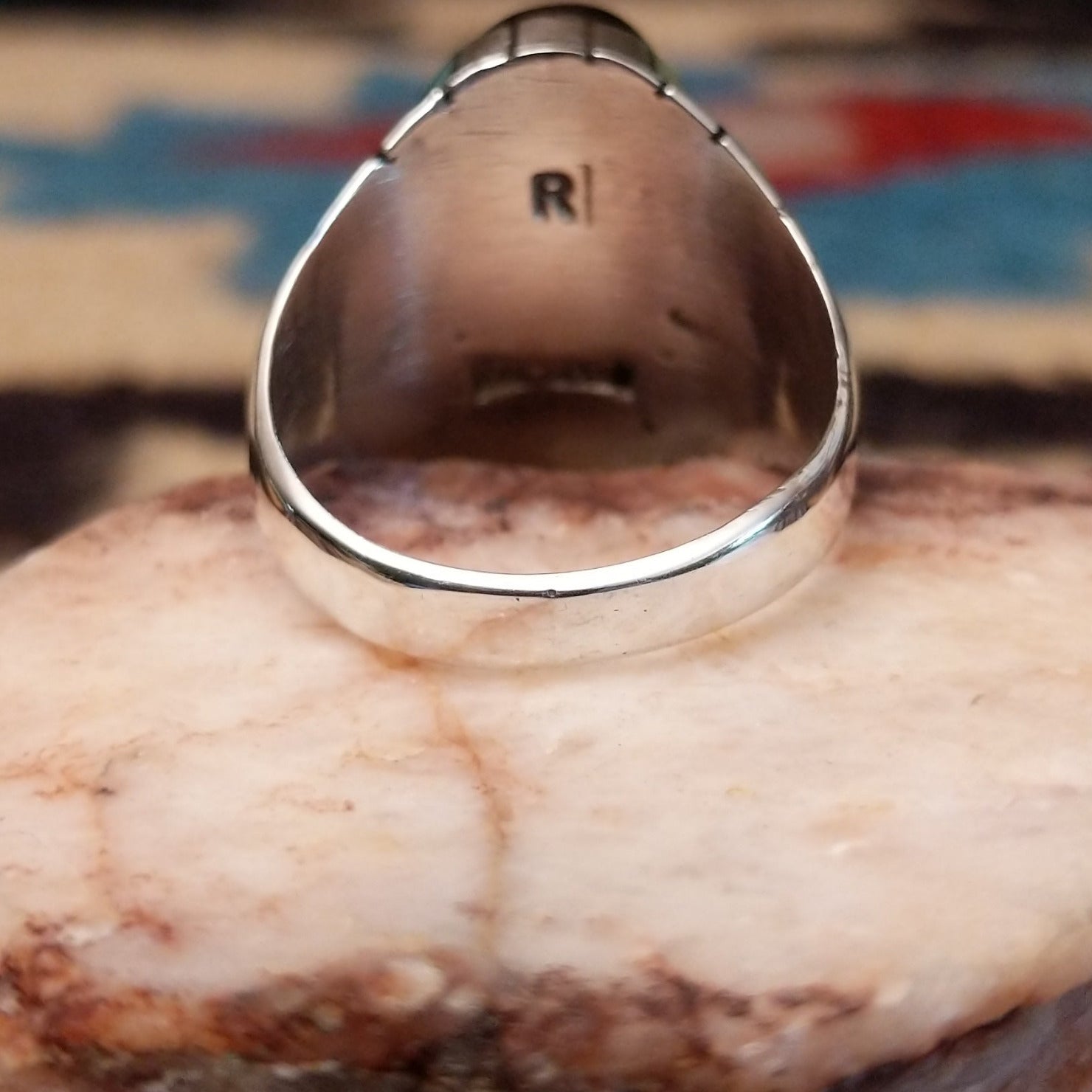 Sterling silver ring with geometric cannel work and black onyx inlay.
