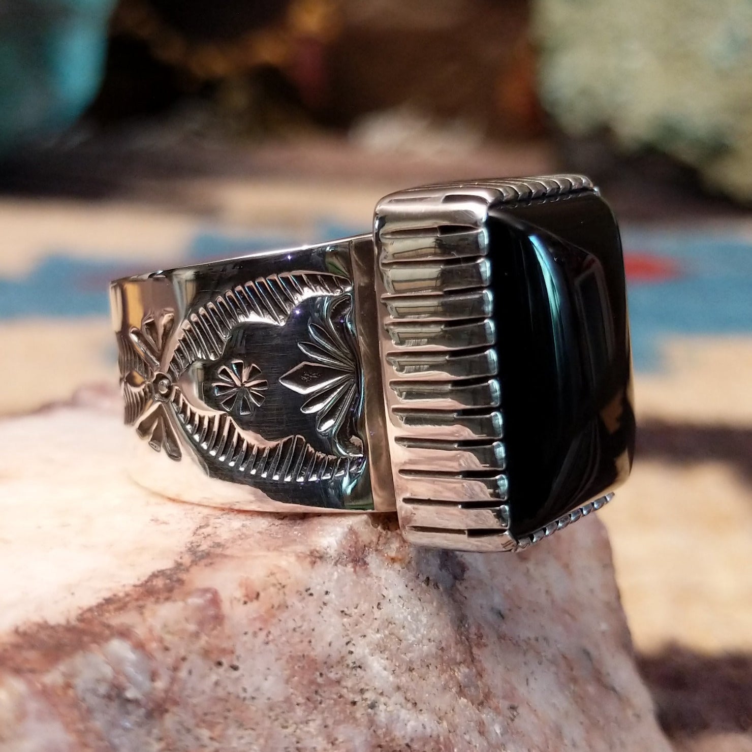 Sterling silver ring featuring Southwestern hand-stamping and black onyx.
