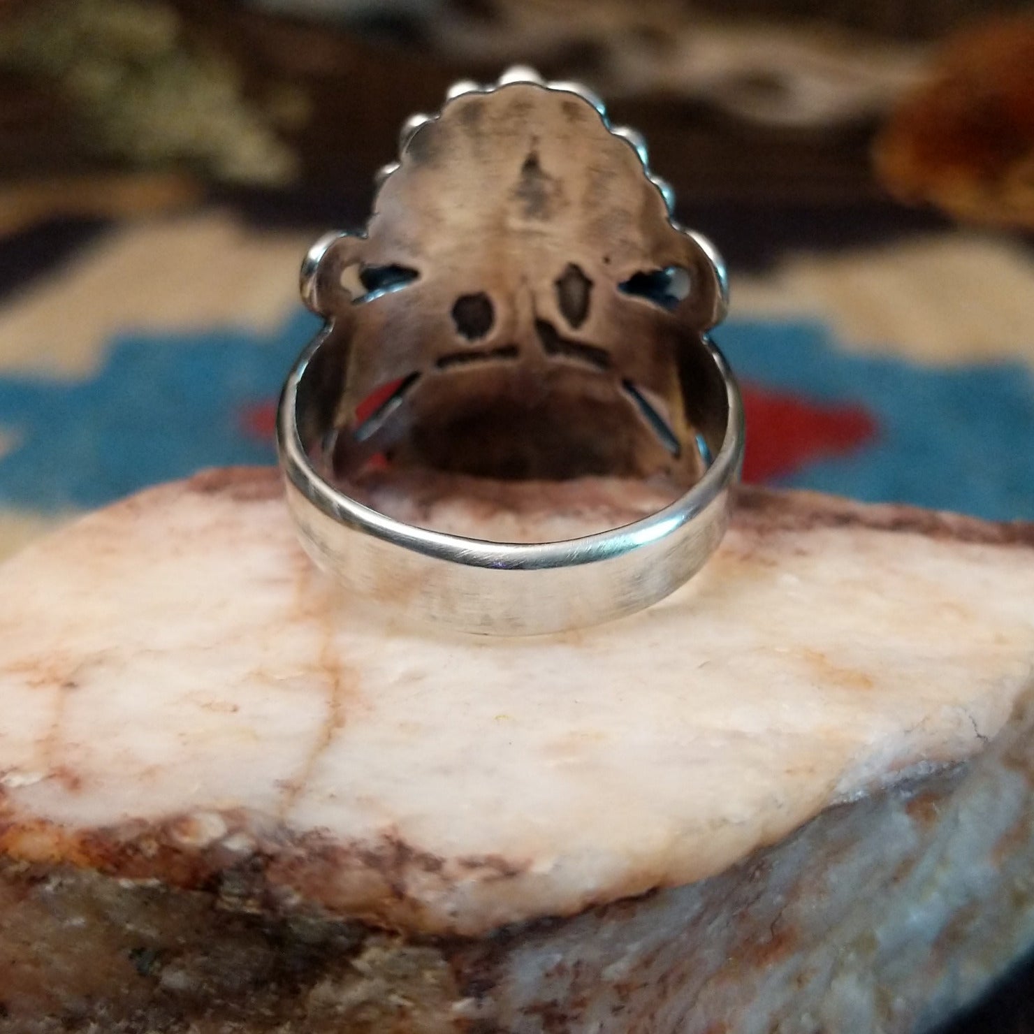 Sterling silver ring with black onyx set in the bezel, framed by twisted rope and unique silverwork.