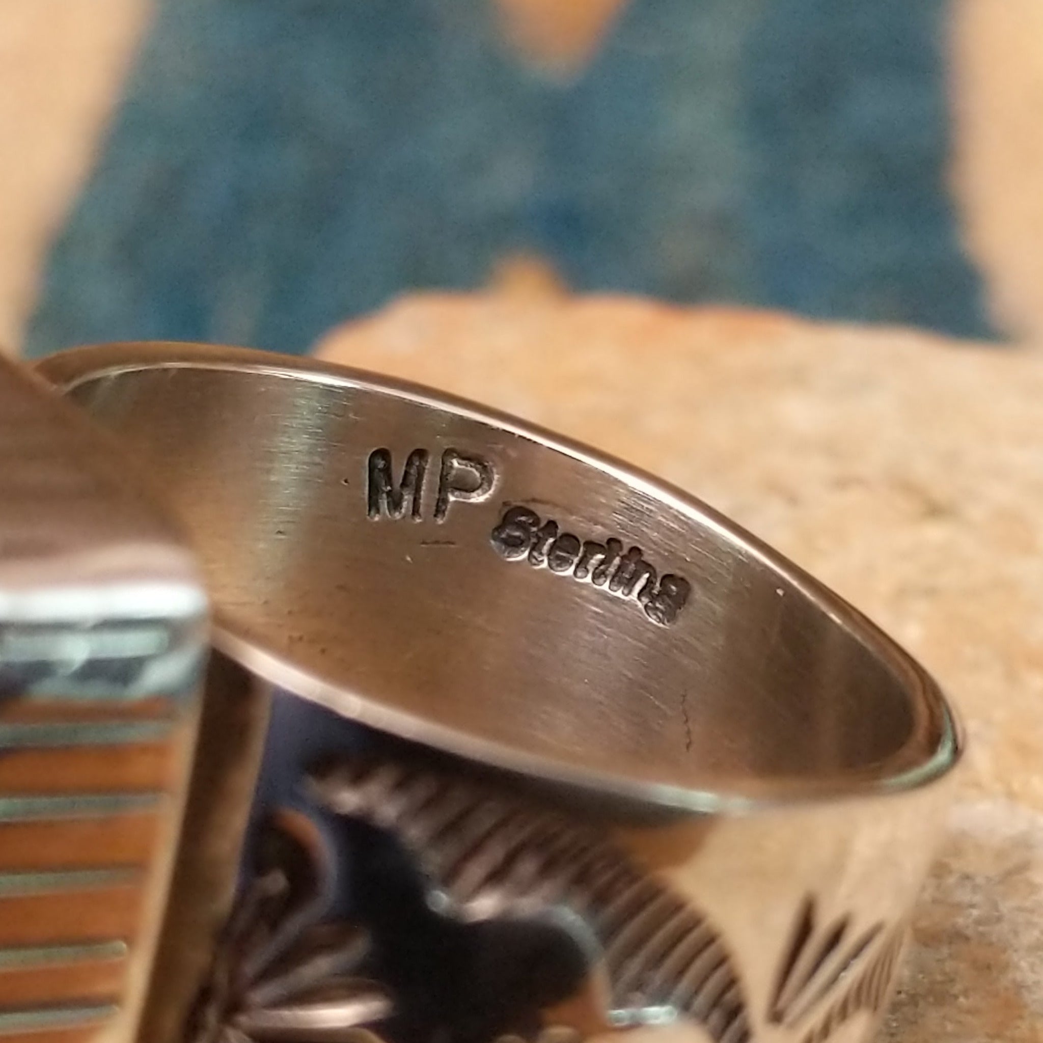 Handcrafted Navajo sterling silver ring by Murphy Platero featuring a polished black onyx cabochon set in a traditional Southwestern silver setting with a timeless, understated design; artisan and Sterling Silver stamp.