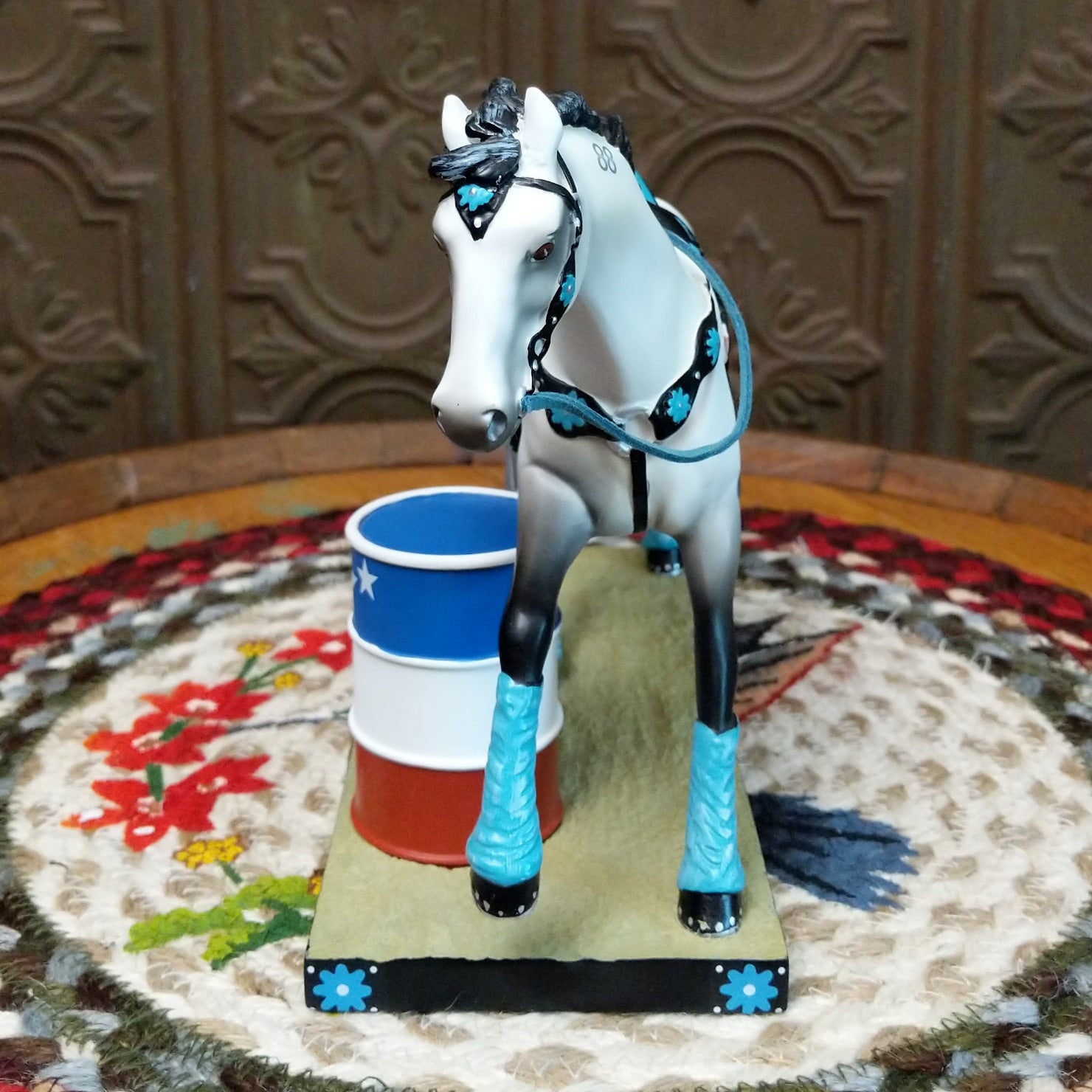 "Blazing Barrels" collectible pony by The Trail of Painted Ponies, featuring detailed hand-painted rodeo-inspired artwork, bold Western designs, and vibrant colors. Front view.