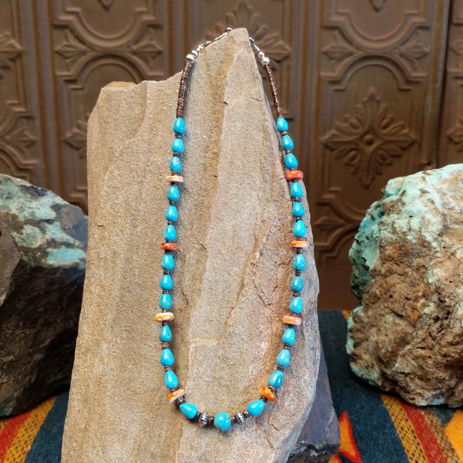 Beaded Blue Gem turquoise and shell necklace strung along the sterling silver chain in a patterned design.