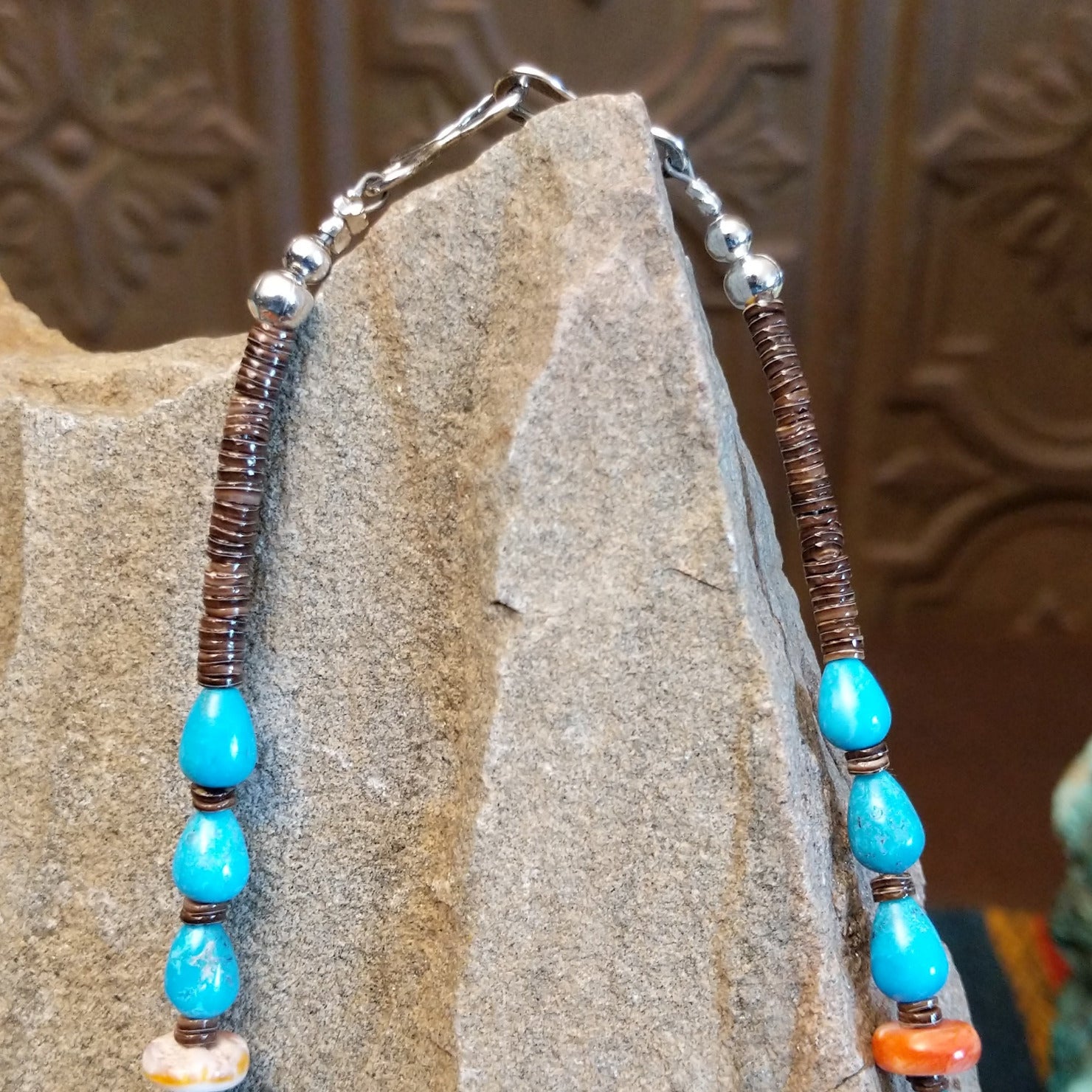 Beaded Blue Gem turquoise and shell necklace strung along the sterling silver chain in a patterned design.