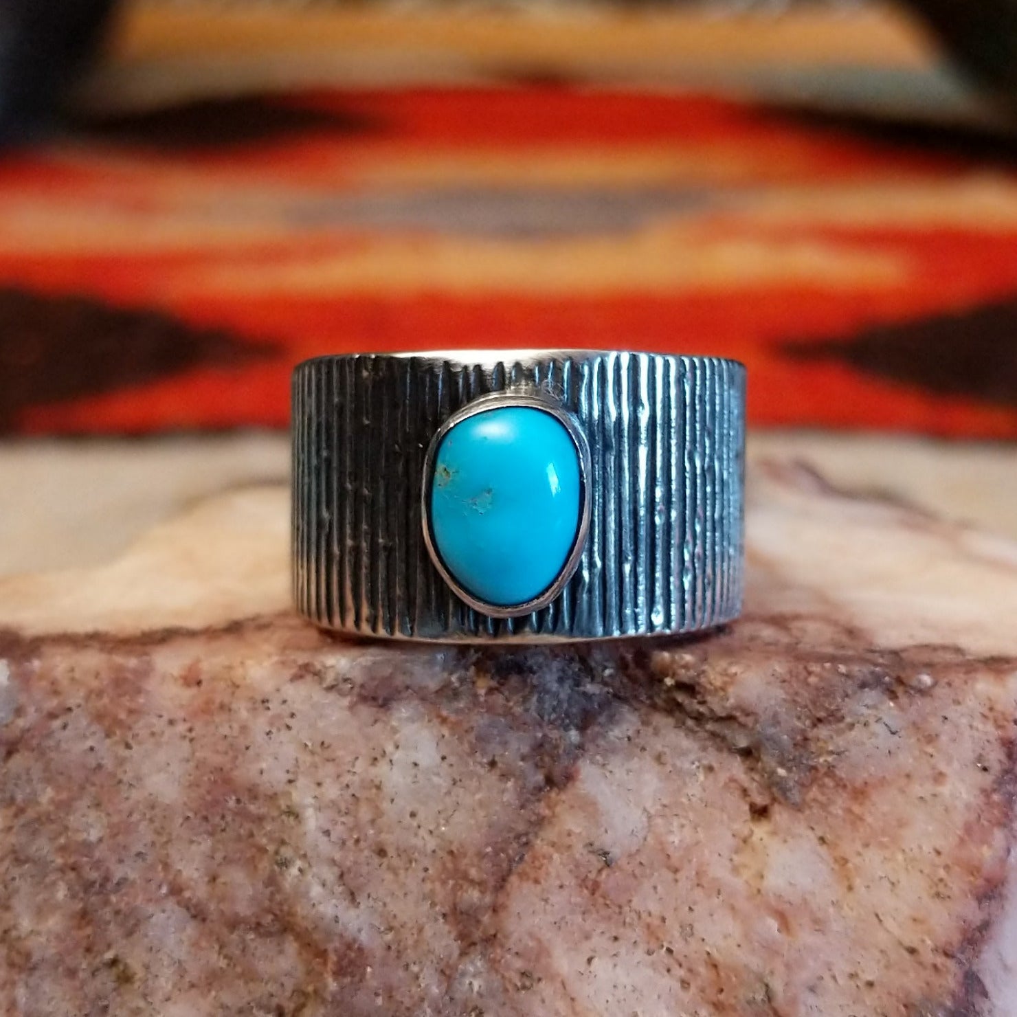 Sterling silver ring with ridged band and Blue Ridge turquoise set in the raised bezel.
