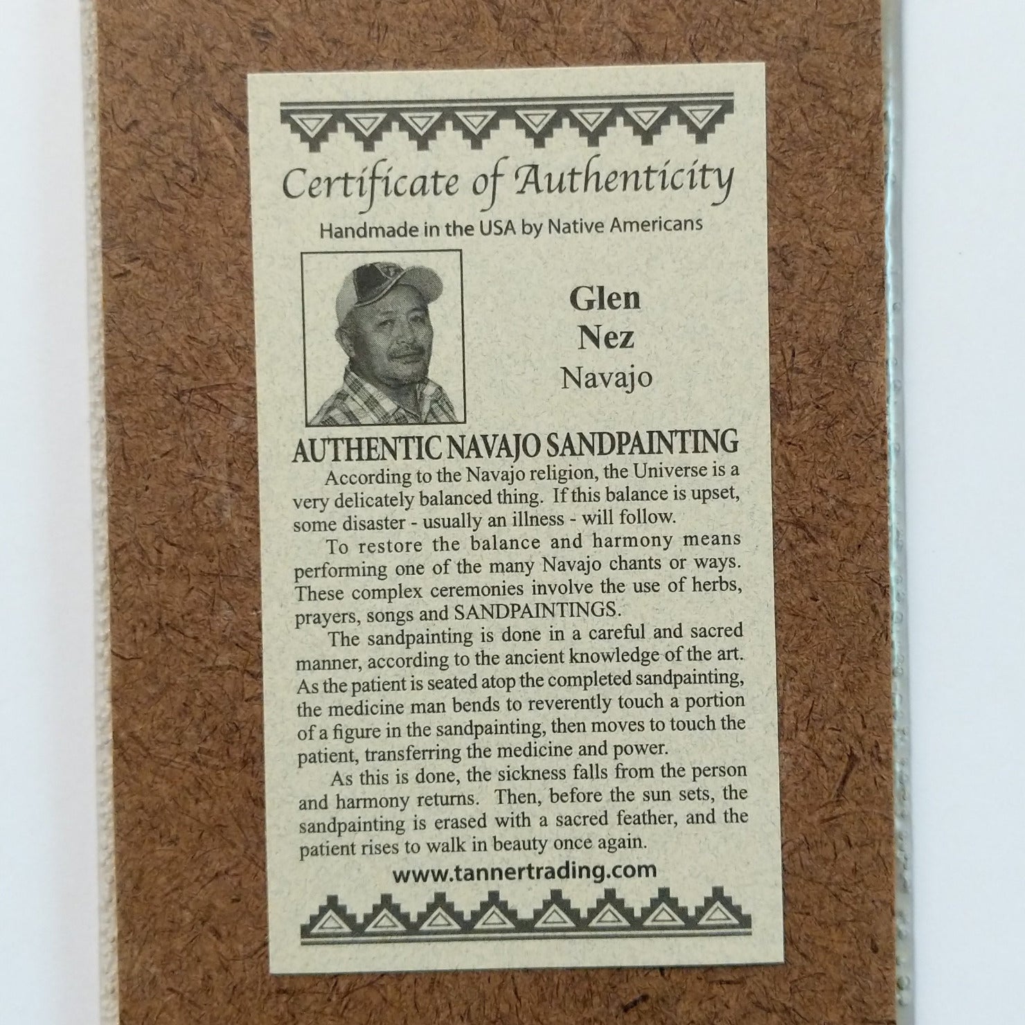 Close up of the Certificate of Authenticity and Artist information.