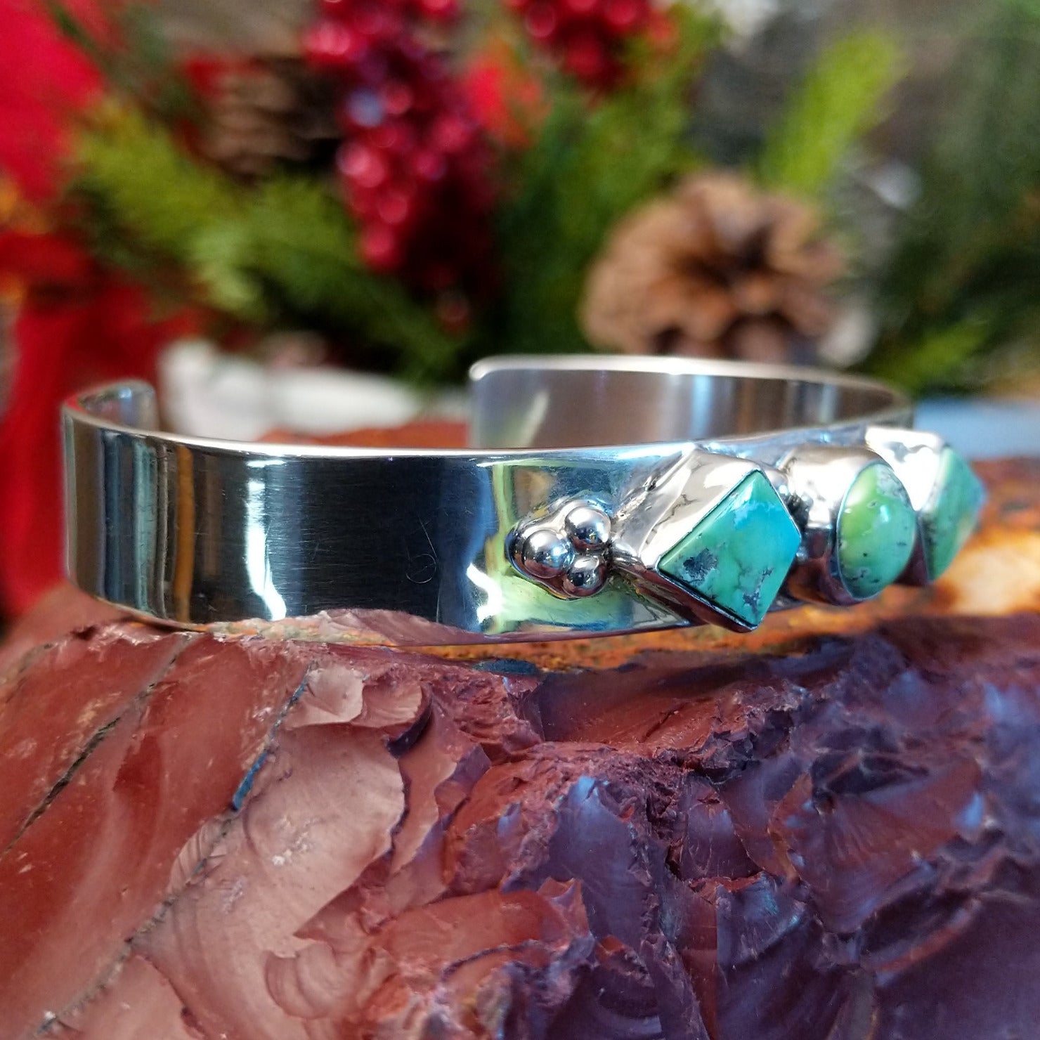 Sterling silver cuff bracelet with Carico Lake turquoise set in three bezels.