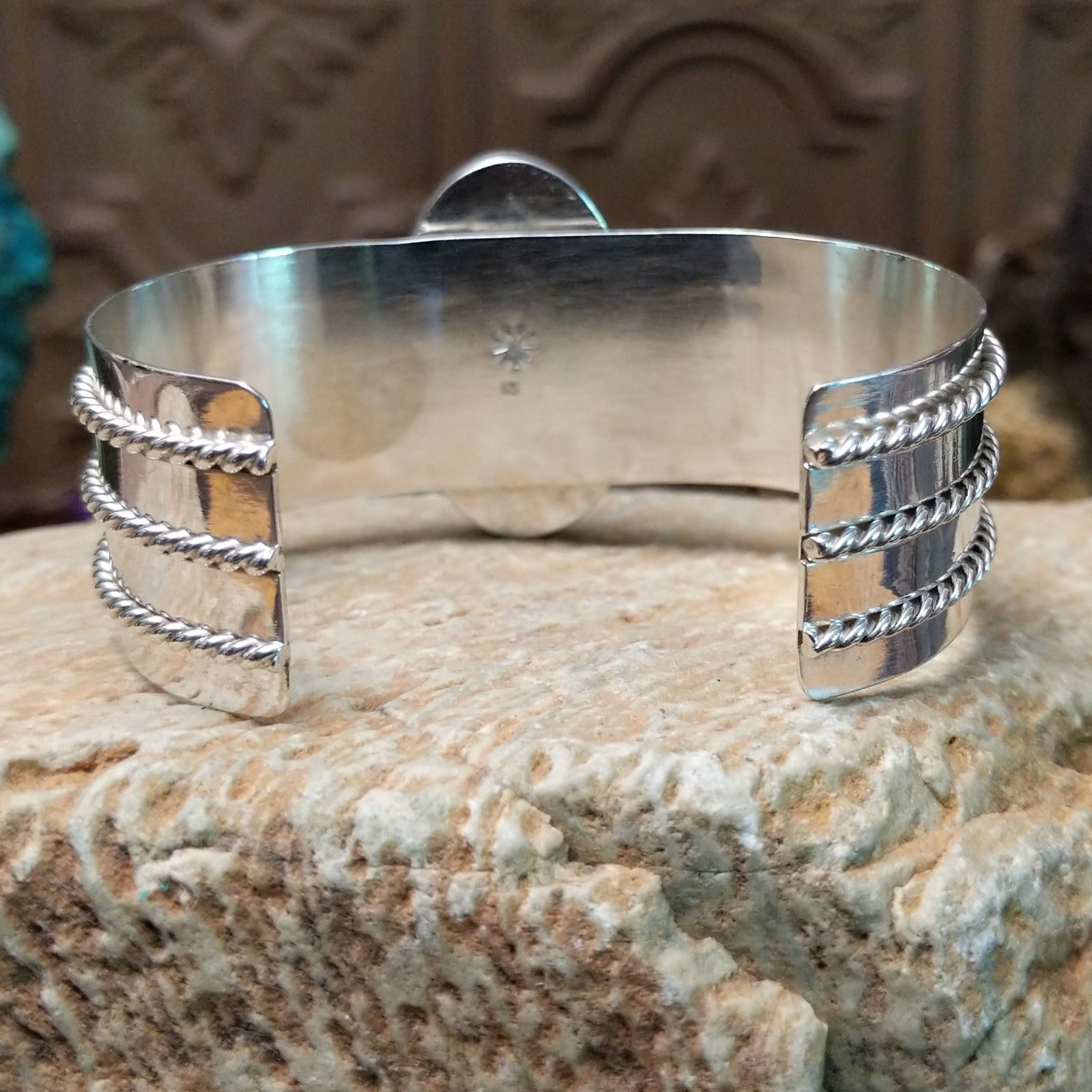 Sterling silver cuff bracelet with Chinese turquoise set in the large, oval bezel and feather silverwork on the band.