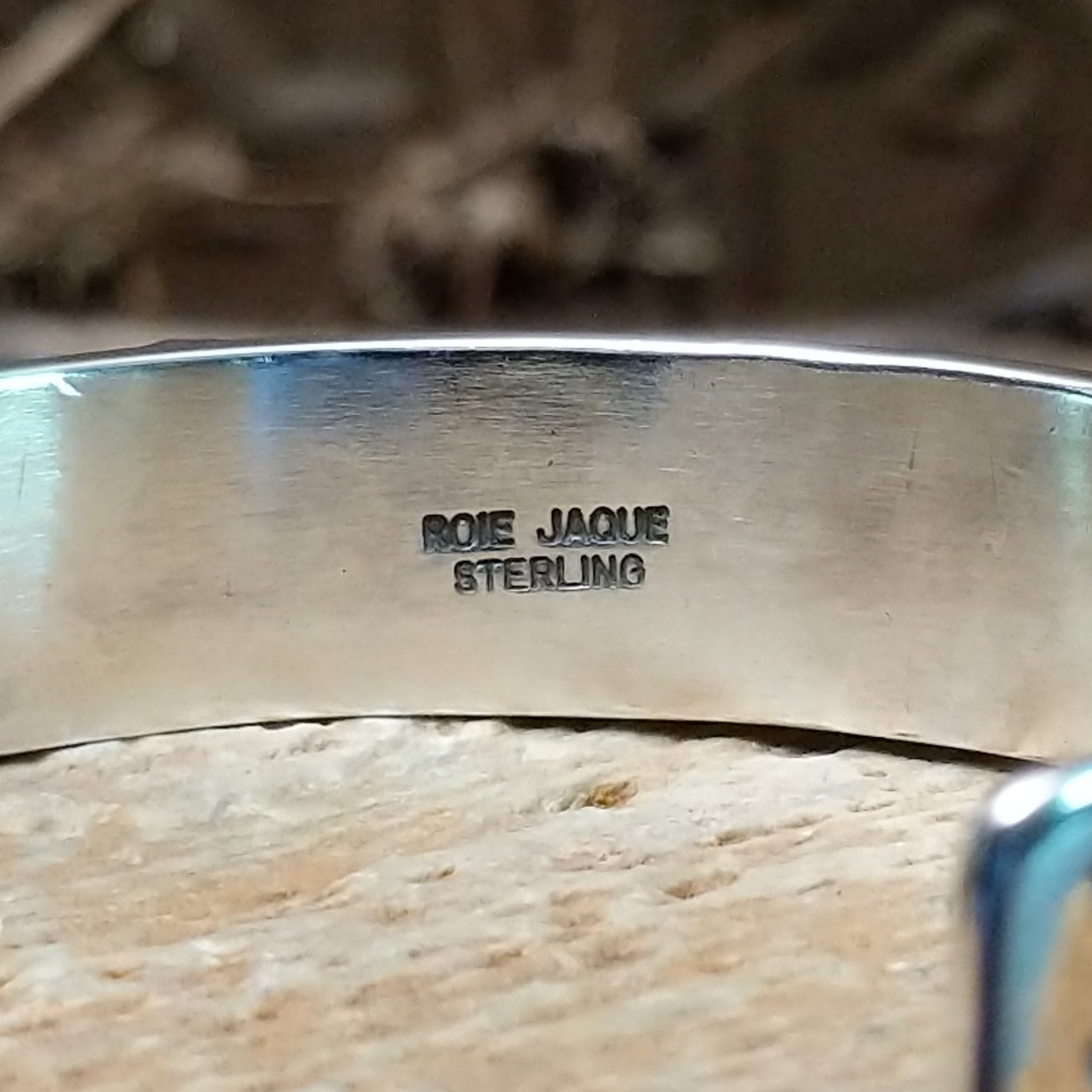 Close-up of the artisan's stamped signature.