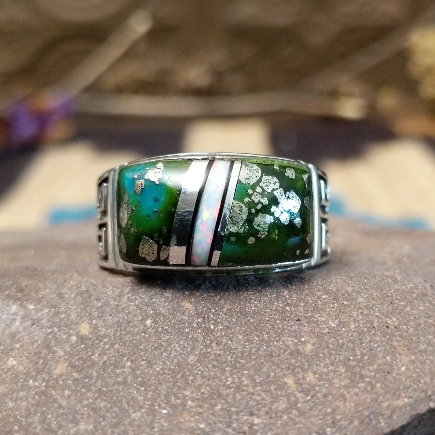 Sterling silver ring with inlay of Sonoran gold turquoise and white manmade opal set in the square bezel.
