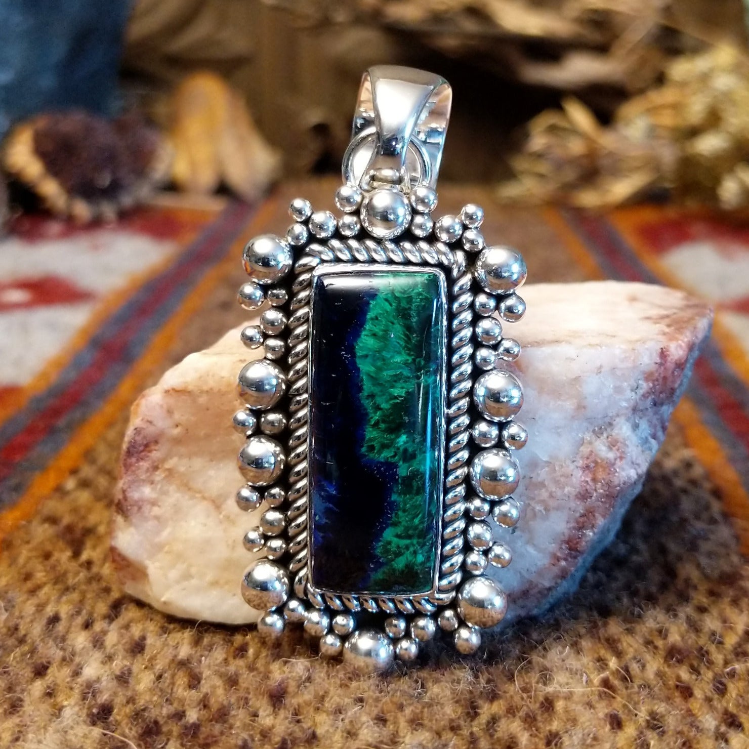 Square sterling silver pendant with azurite set within the bezel, twisted rope accents, and dotted detailing.