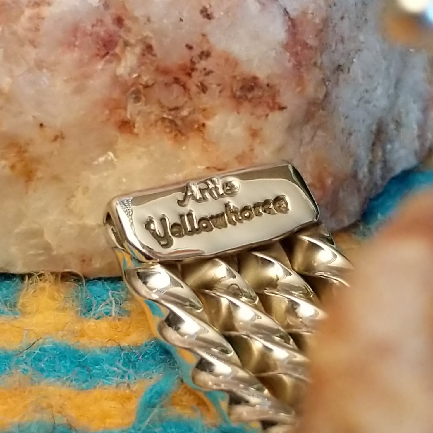 Close-up of the artisan's stamped signature.