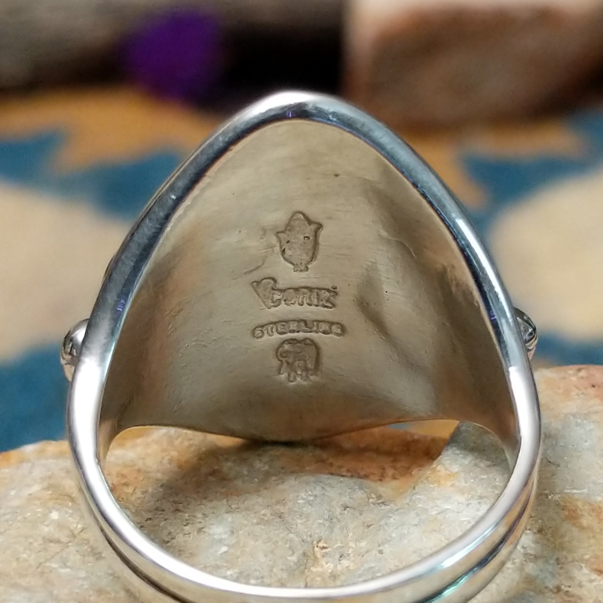 Sterling silver Malachite ring by Raymond Coriz featuring four oval green stones with natural banding; artisan and Sterling Silver stamp.