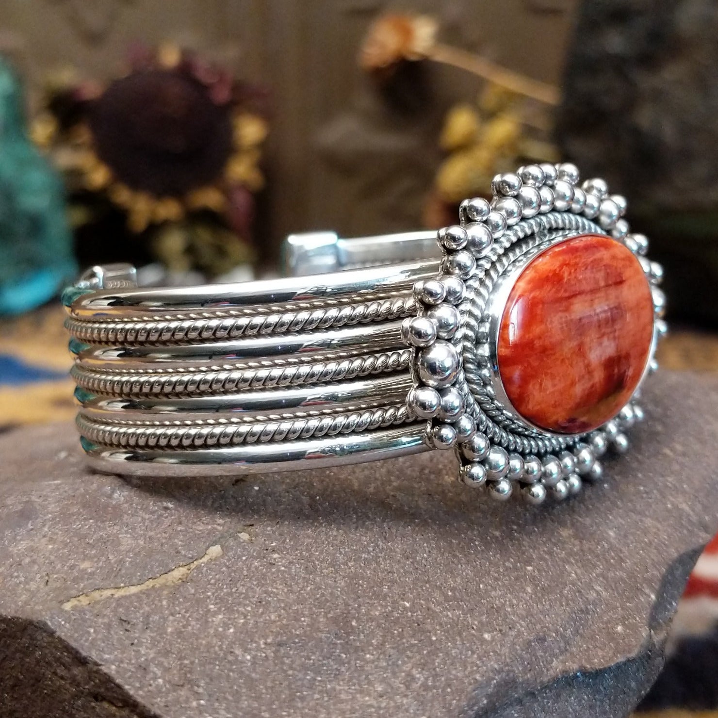 5 row sterling silver cuff featuring spiny oyster shell set in a twisted rope bezel.