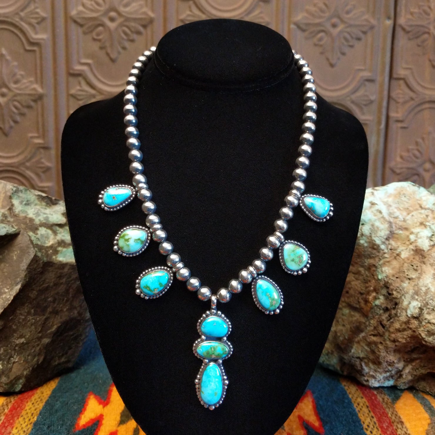 Necklace with Sonoran Mountain turquoise set in bezels along the beaded silver chain.