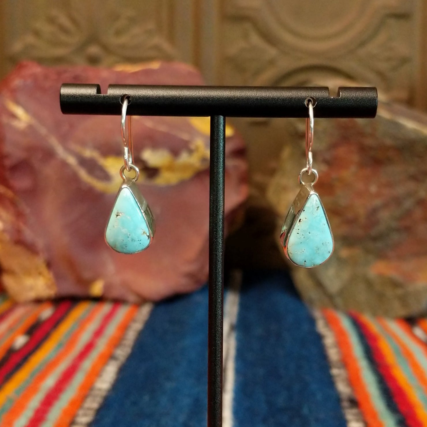 Dry Creek turquoise set tear drop shaped sterling silver bezels.
