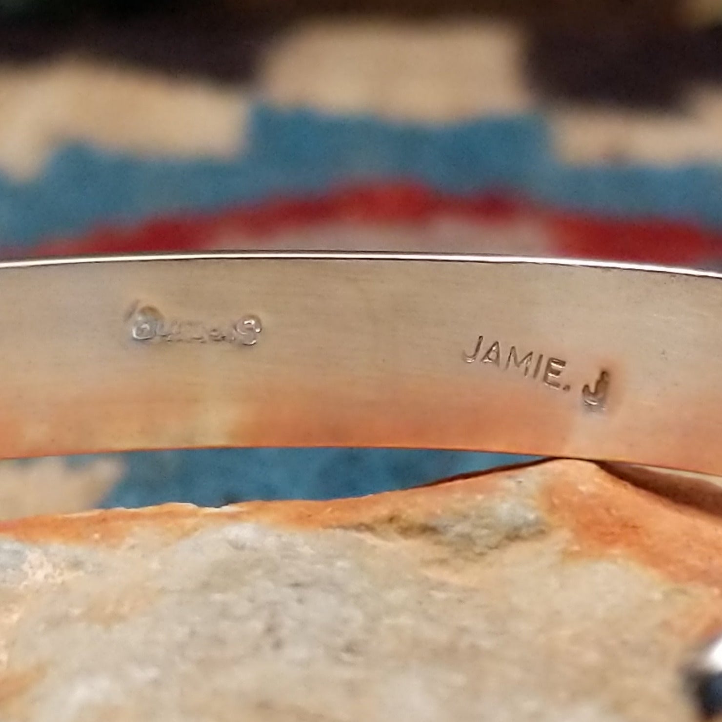 Dual row manmade opal inlay cuff by Jamie Johnson, featuring shimmering opal inlay with vibrant flashes of color set in handcrafted Southwestern-inspired metalwork. Artisan and Sterling Silver stamp.