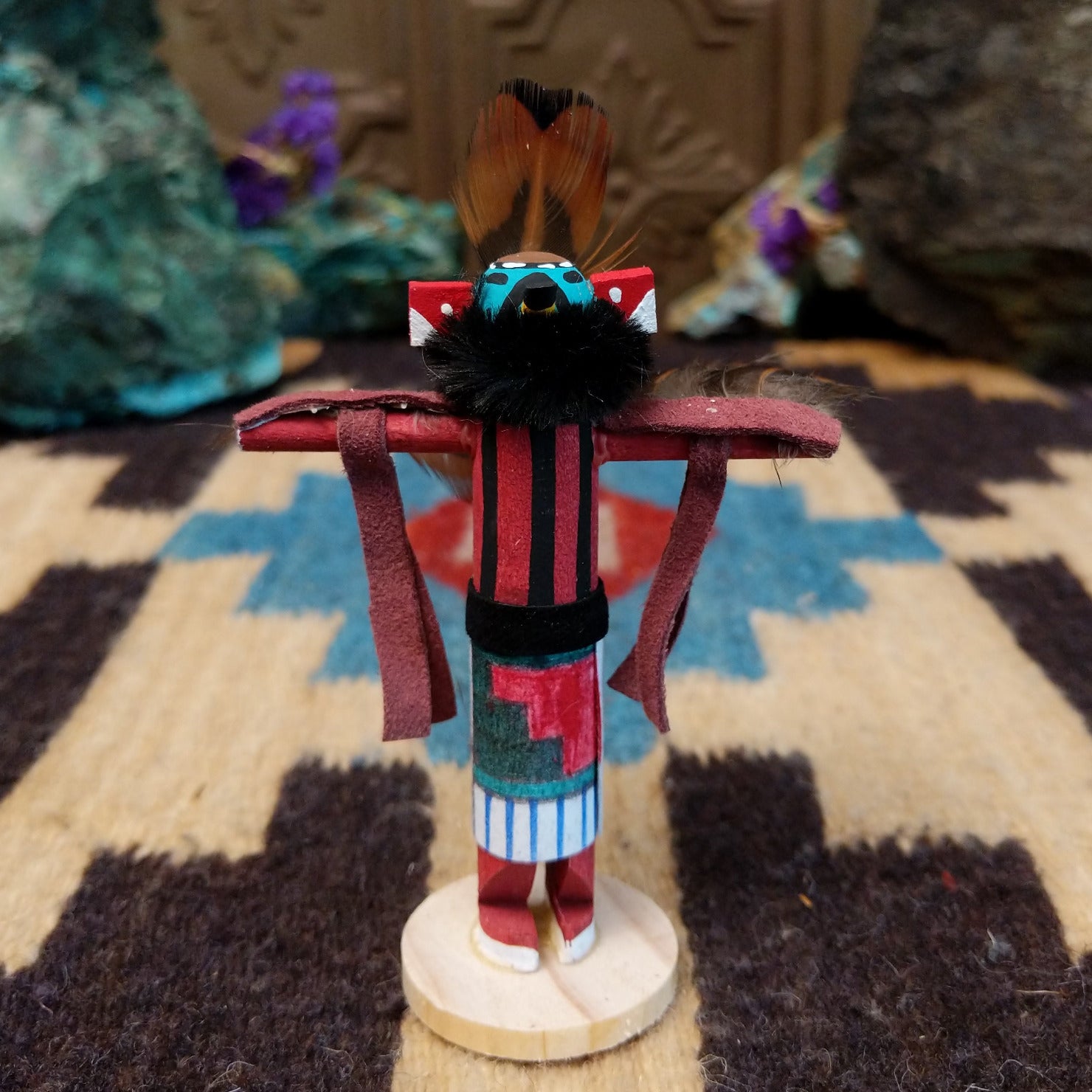 Mini eagle kachina by Rosalind Grey with turquoise face, black fur collar, feathered crest, and outstretched arms.