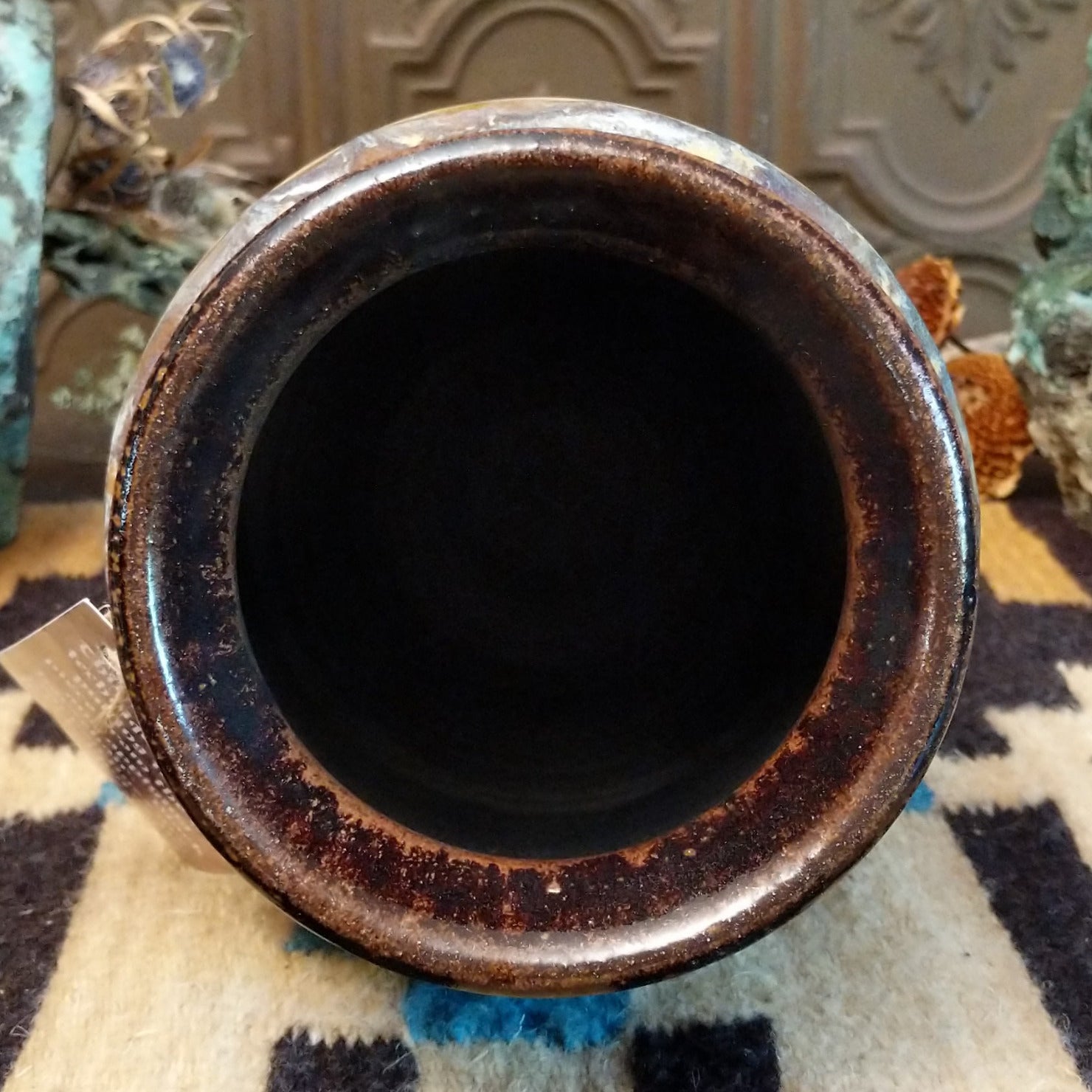 Ceramic, horsehair, and copper pottery piece.