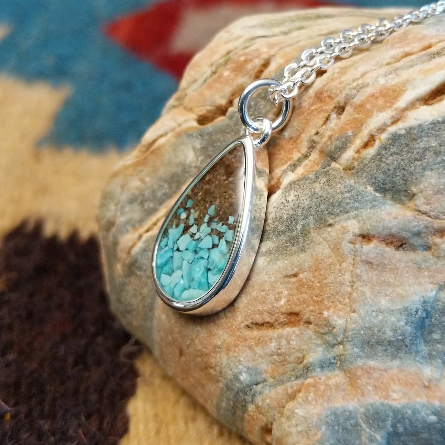 Silver-plated brass necklace with turquoise and San Pedro River sand set in the teardrop bezel.