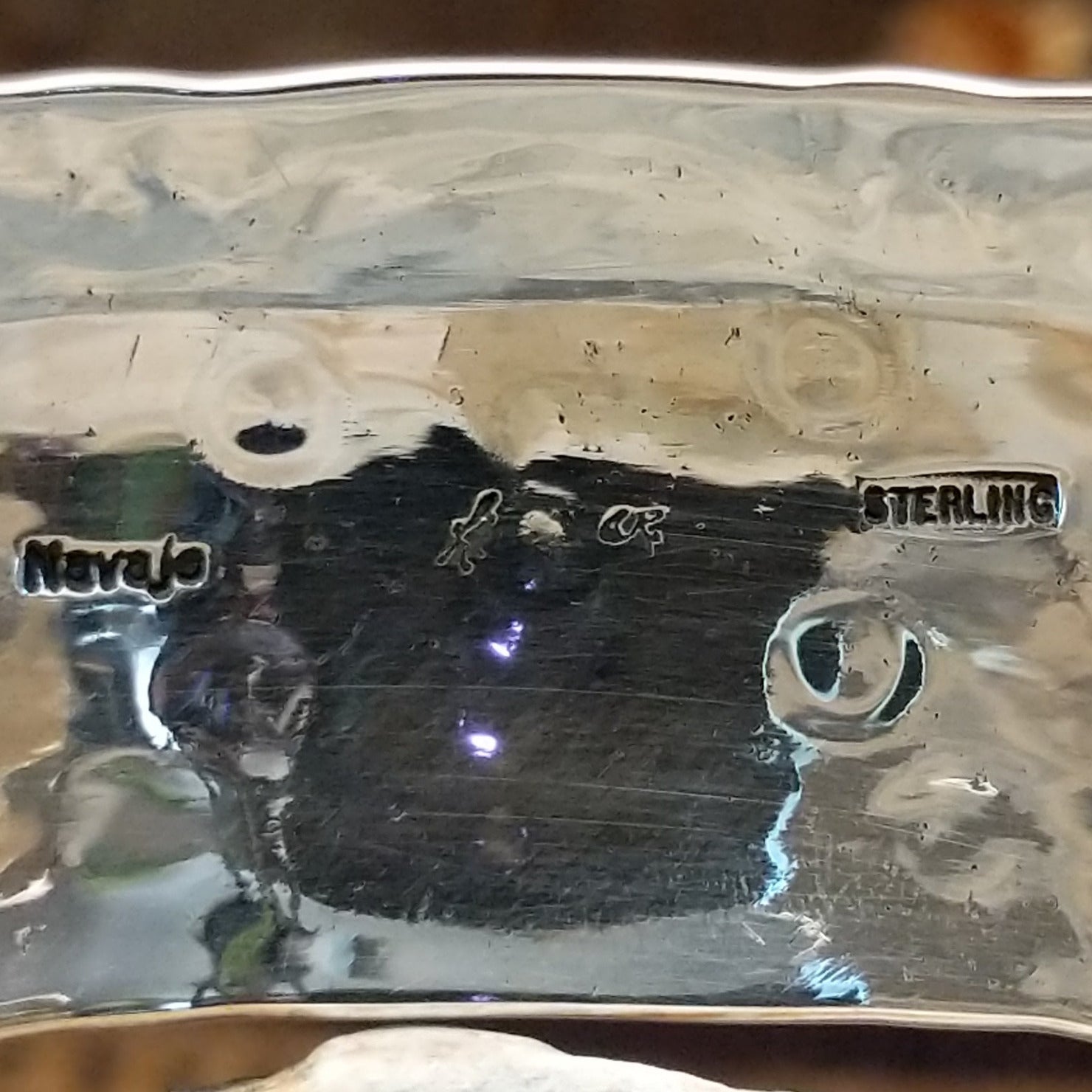 Close up of the artists stamped signature.