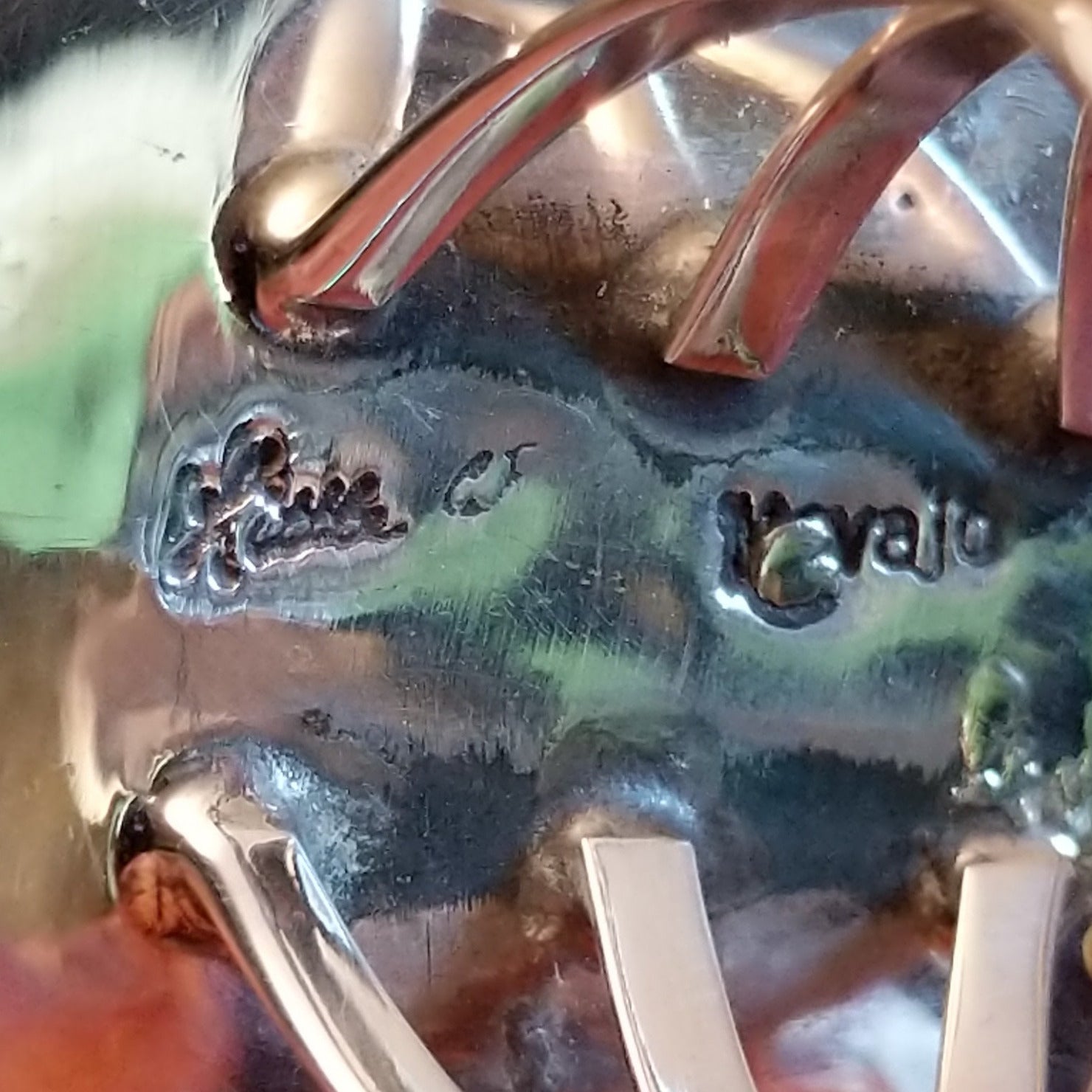 Close-up of the artisans stamped signatures.