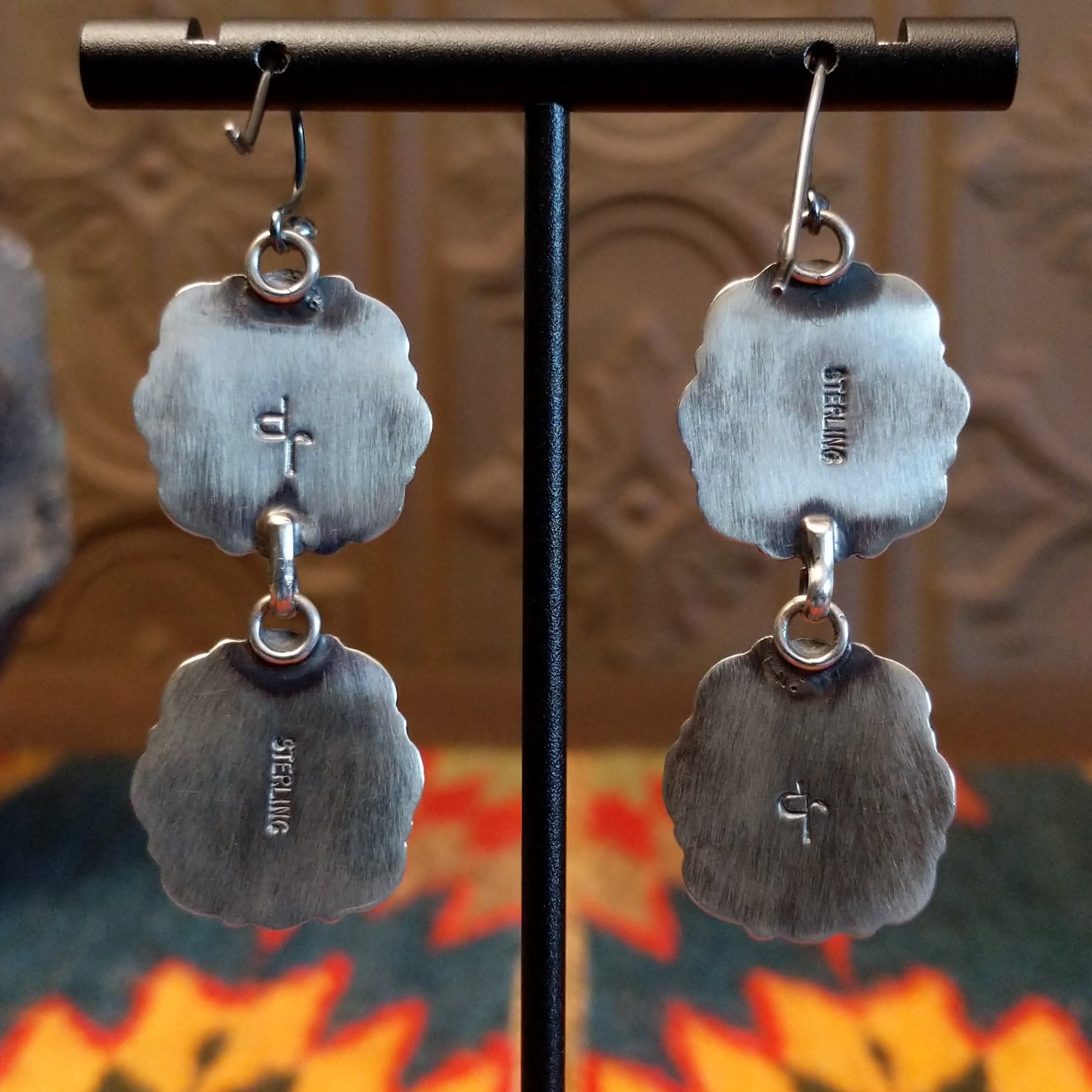 Close-up of the artisan's stamped initials.