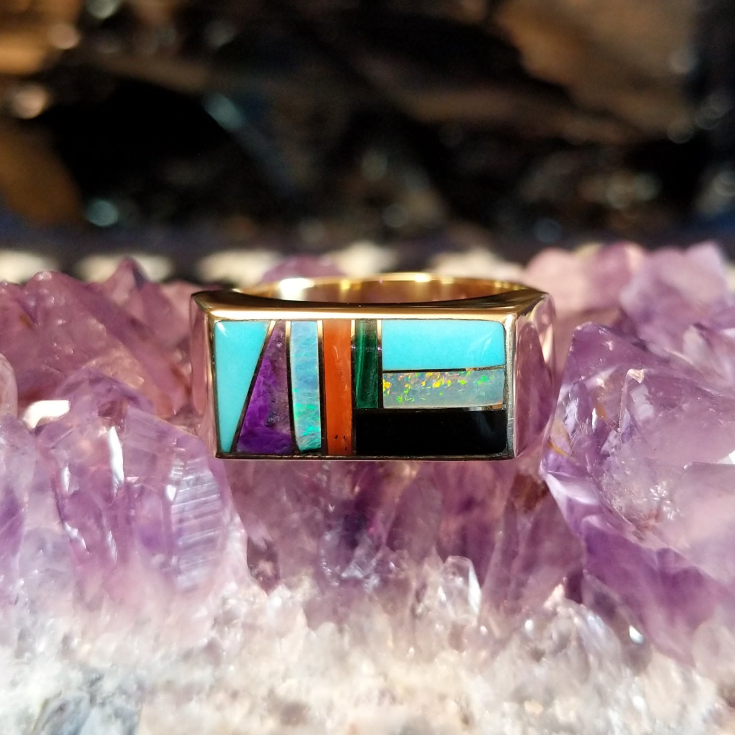 Gold rectangular ring featuring a vibrant multi-stone inlay set in 14k gold.