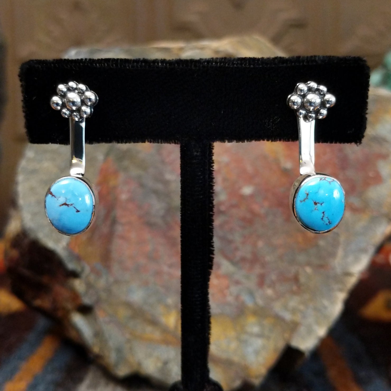 Golden Hills turquoise adjustable earrings with round Golden Hills turquoise stones and light brown matrix veining set on a sterling silver band with a plain bezel, crafted by Navajo artist Terry Wood.