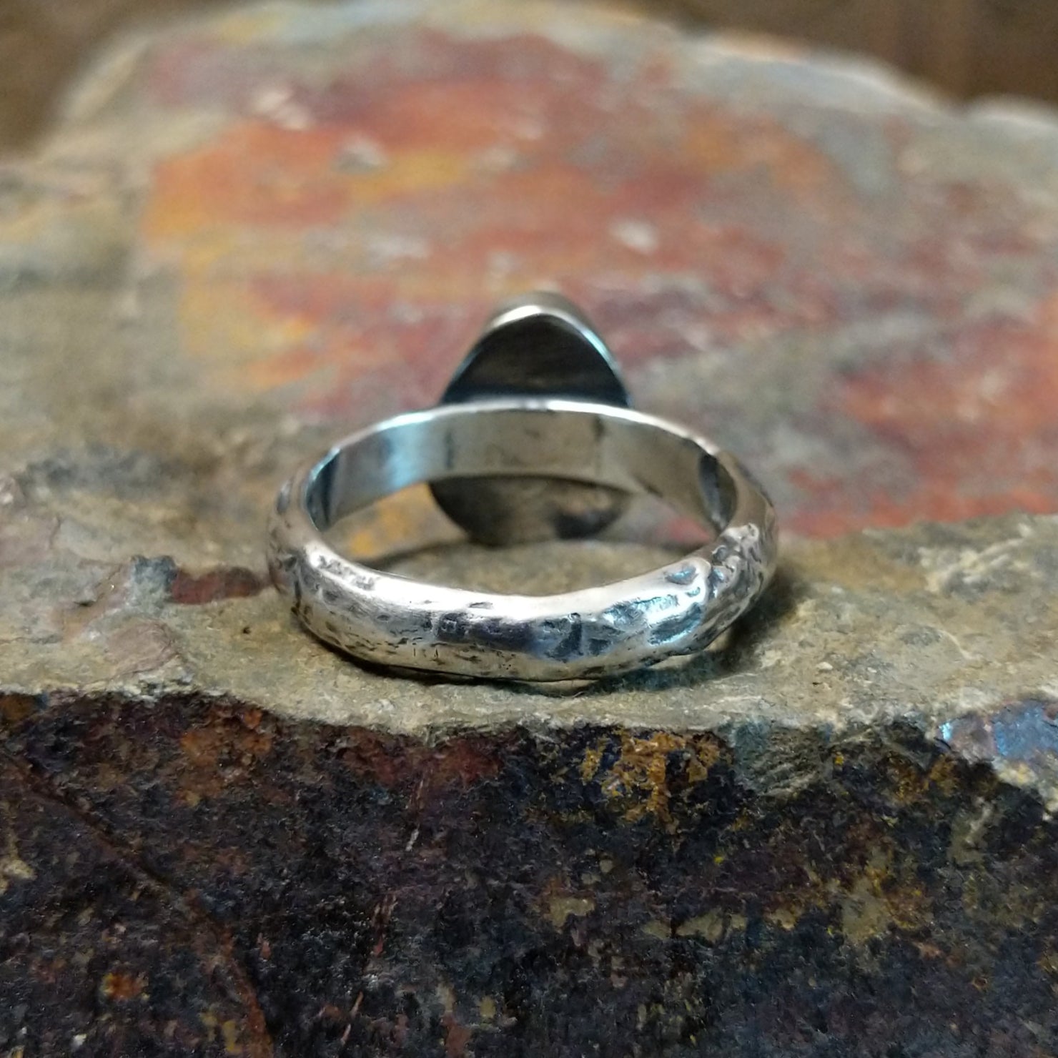 Textured band interior featuring no stone or signatures.