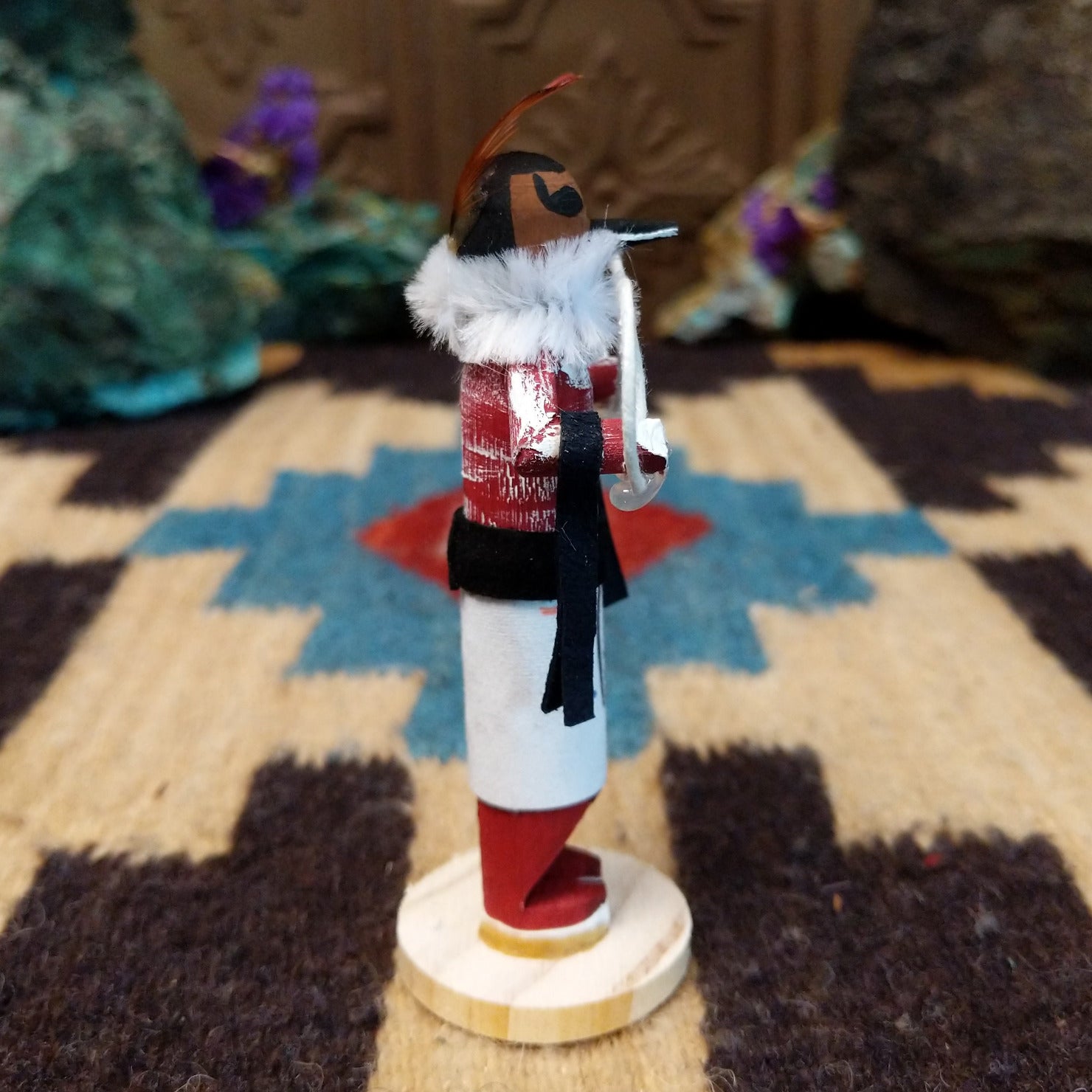 Mini hoop dancer kachina by Rosalind Grey with white hoops, white fur collar, red body, and white geometric-patterned garment.