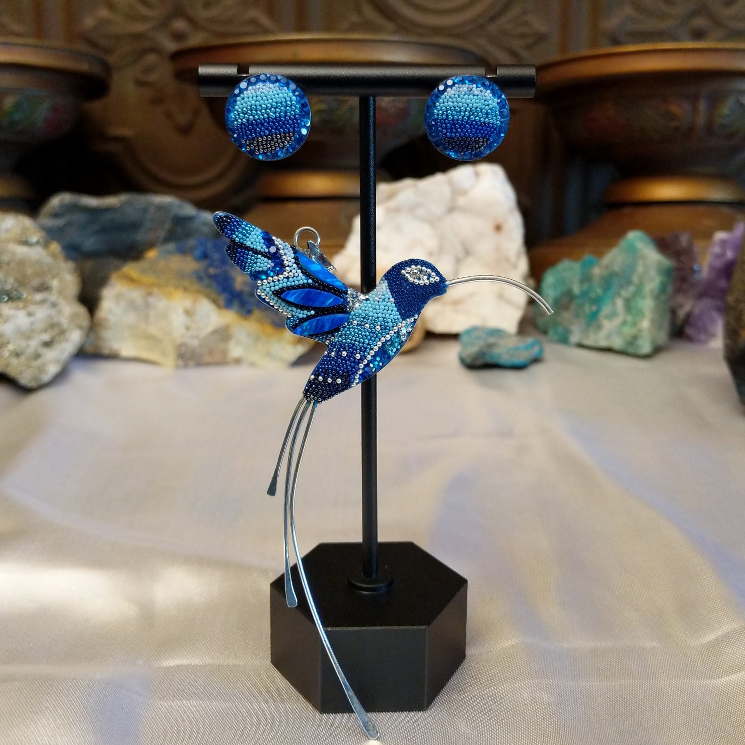 Sterling silver hummingbird necklace and earrings set with blue Austrian crystals.