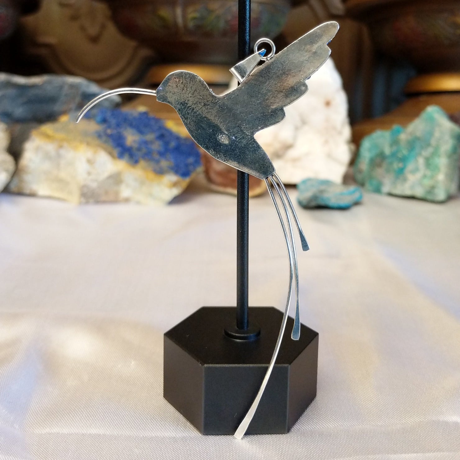 Sterling silver hummingbird pendant with blue Austrian crystals.