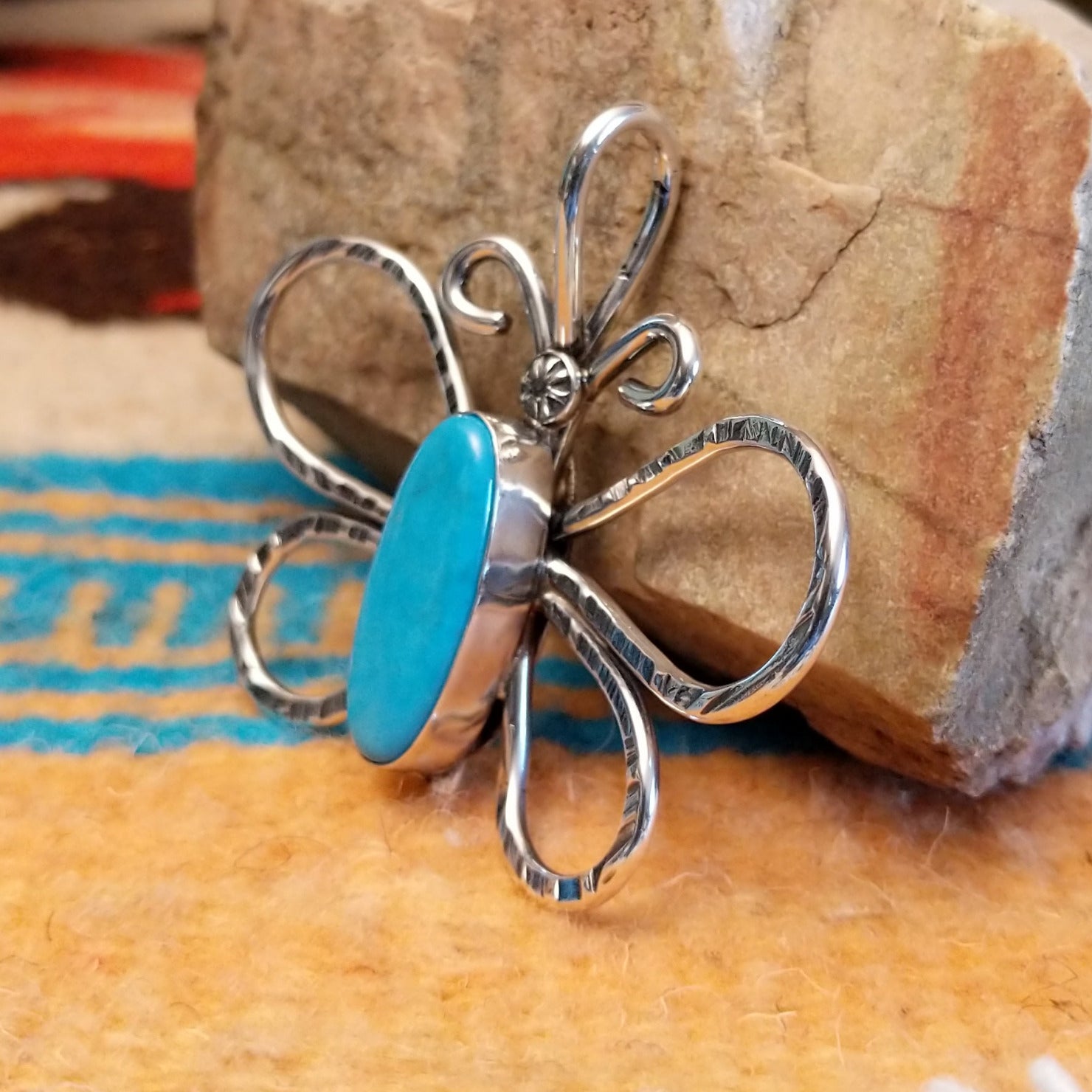 Sterling silver butterfly pendant with Kingman turquoise set in the oval bezel.