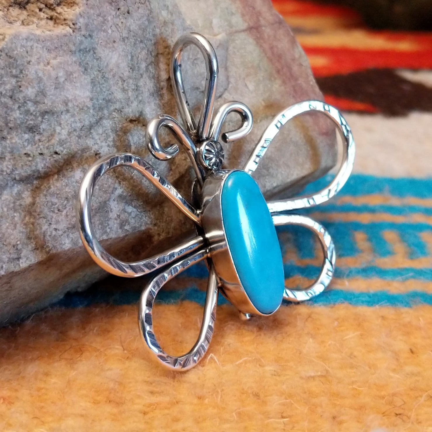 Sterling silver butterfly pendant with Kingman turquoise set in the oval bezel.