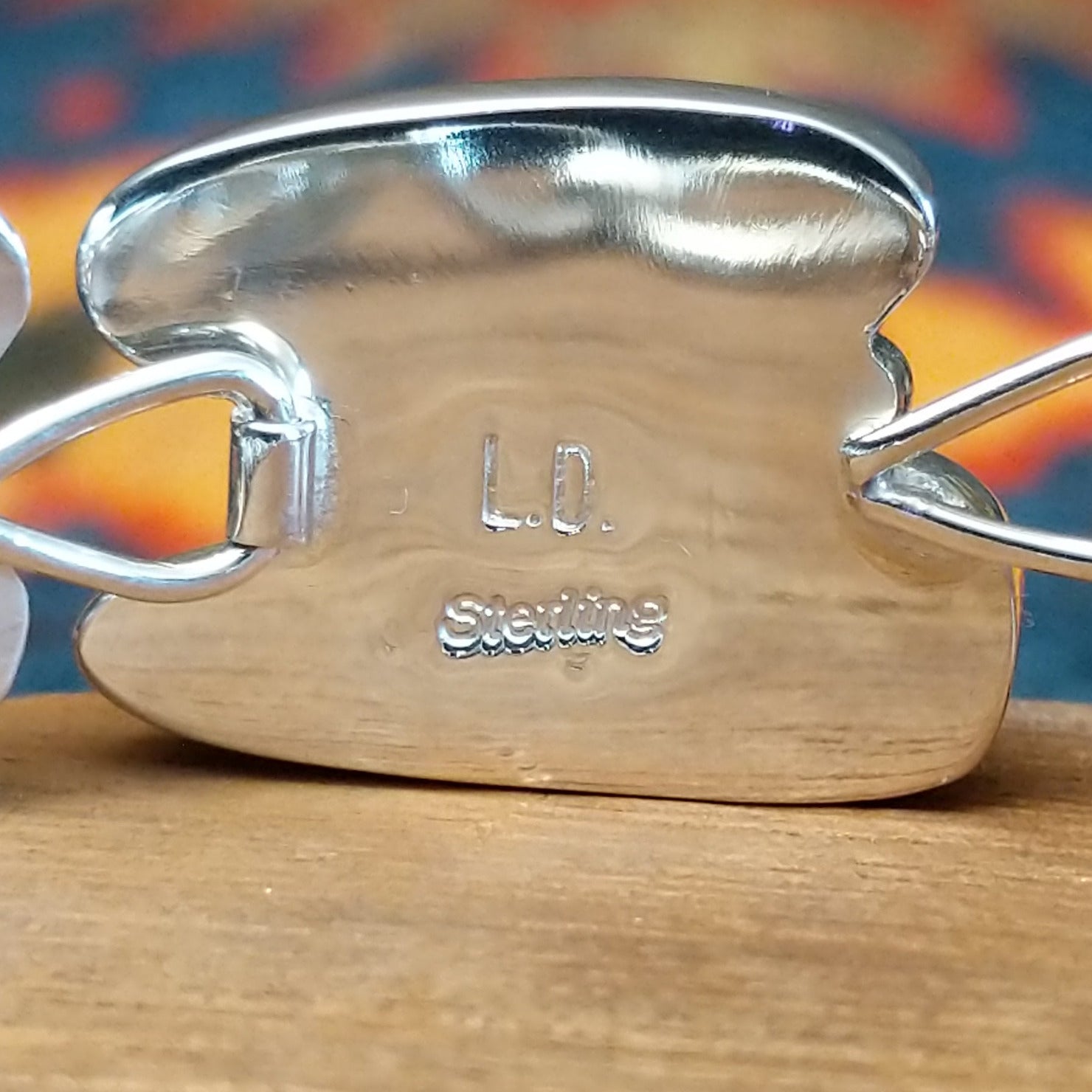 Close-up of the artisan's stamped signature.