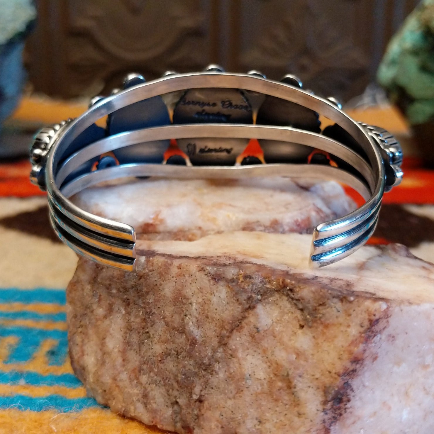 Sterling silver pentad cuff with Kingman turquoise set in round bezels, framed by twisted rope, star, and dotted accents.