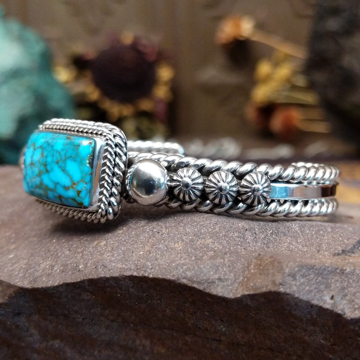 Sterling silver cuff featuring Kingman turquoise and twisted rope accents.