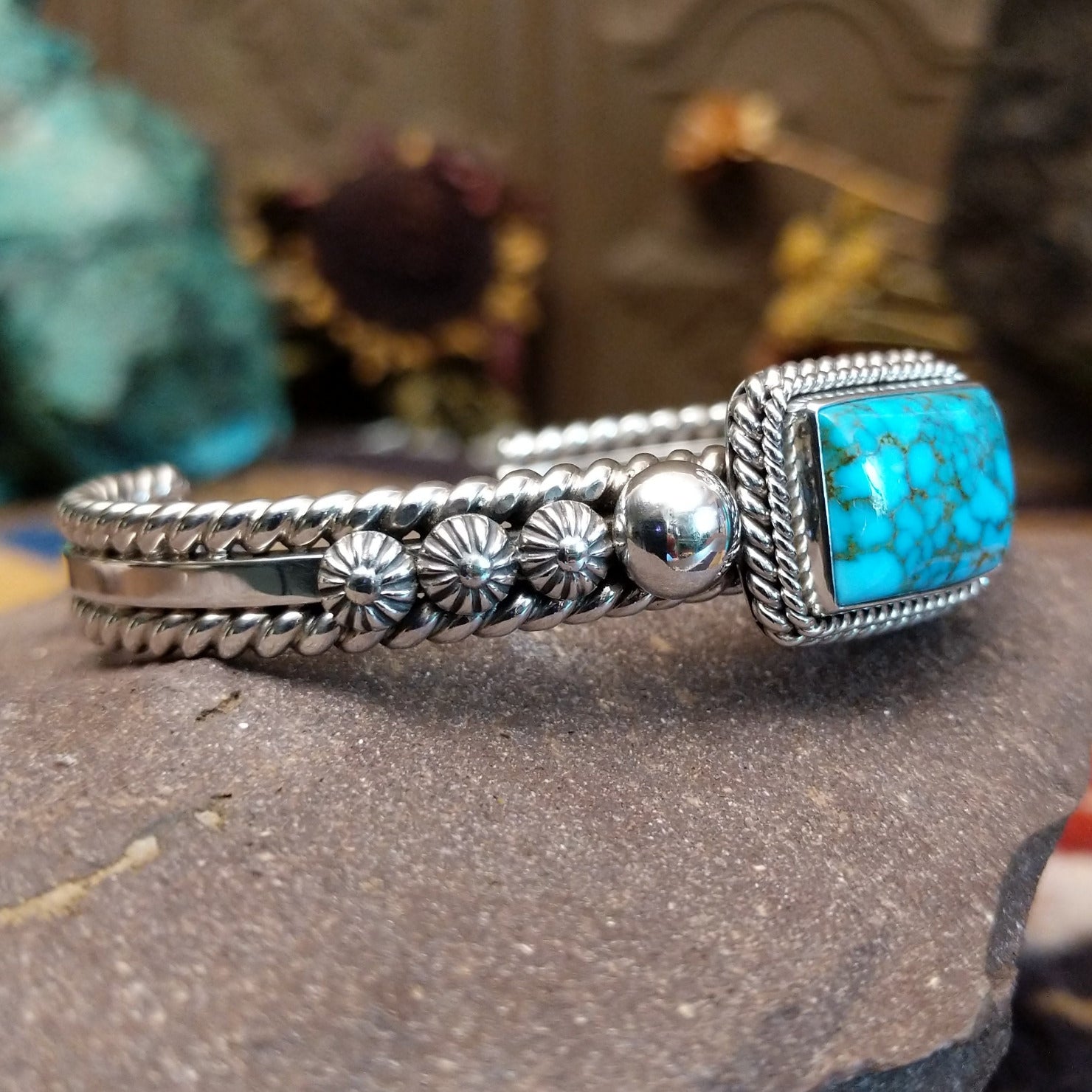 Sterling silver cuff featuring Kingman turquoise and twisted rope accents.