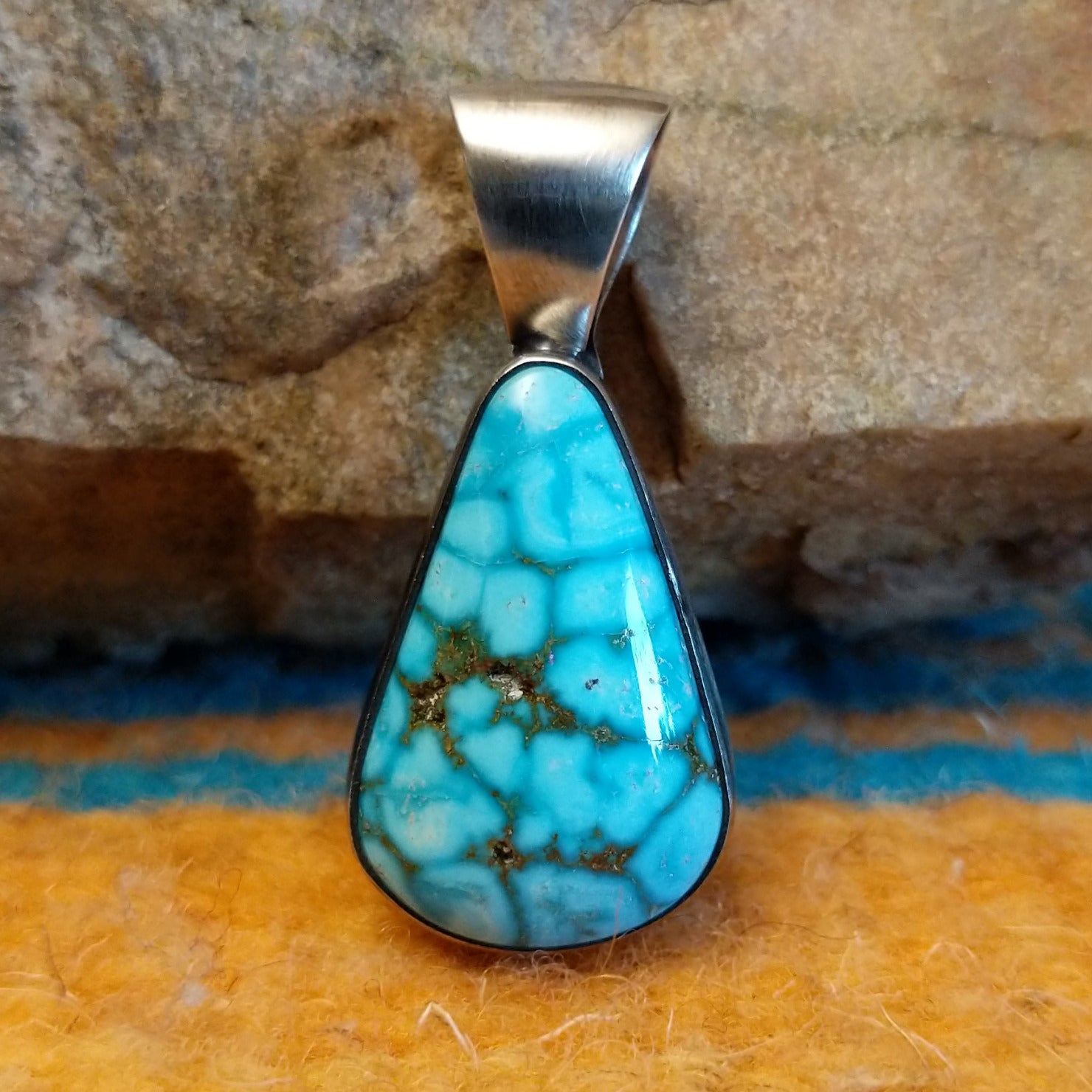 Sterling silver pendant with Kingman turquoise set in the teardrop bezel.