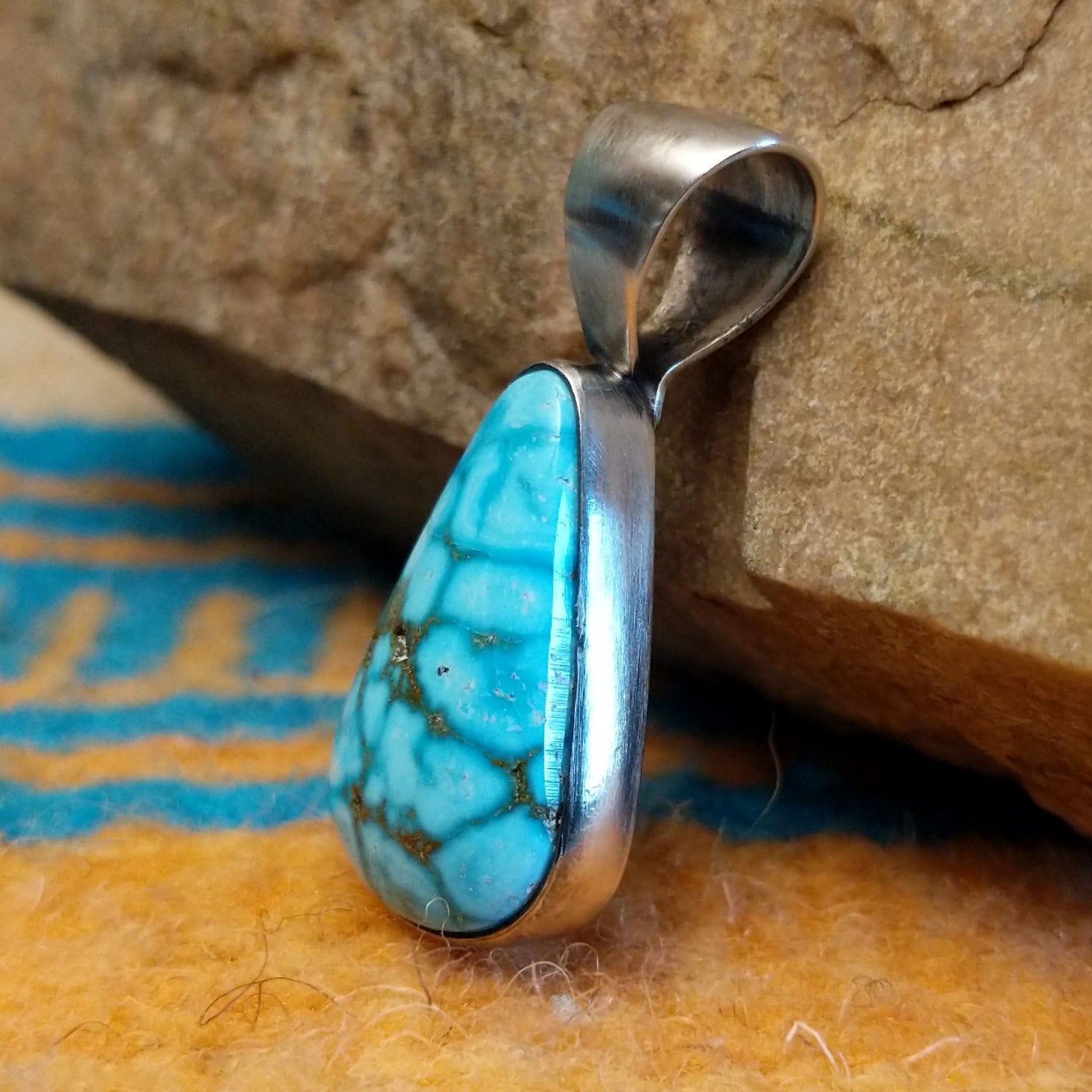 Sterling silver pendant with Kingman turquoise set in the teardrop bezel.