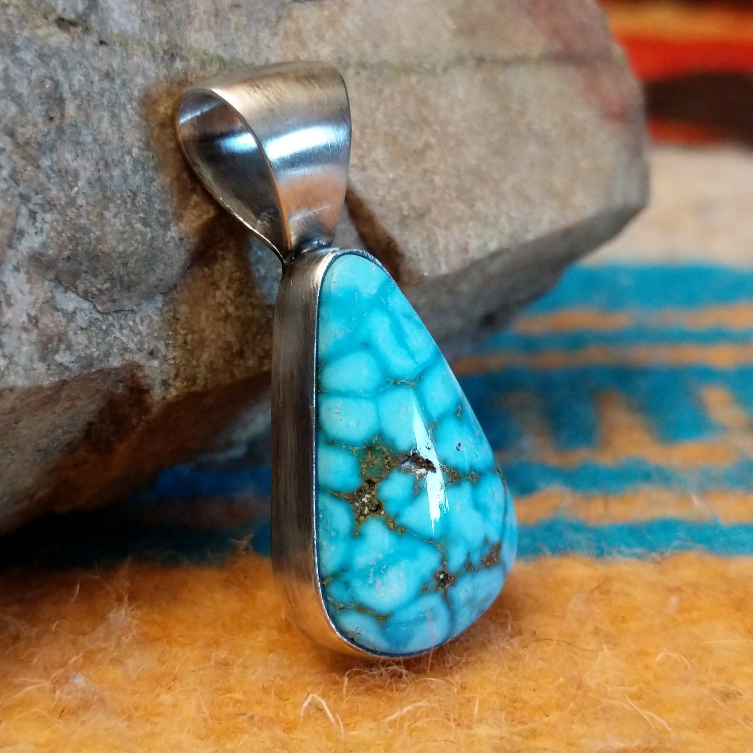 Sterling silver pendant with Kingman turquoise set in the teardrop bezel.