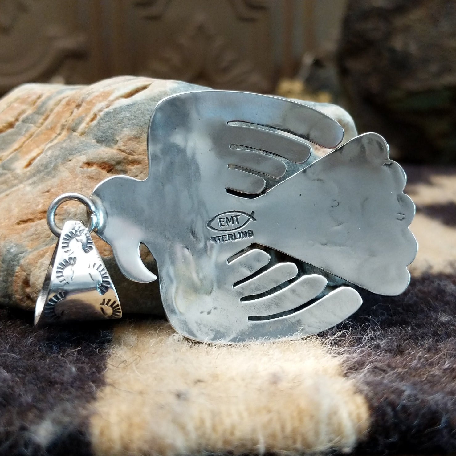 Close-up of the artisans stamped signatures.