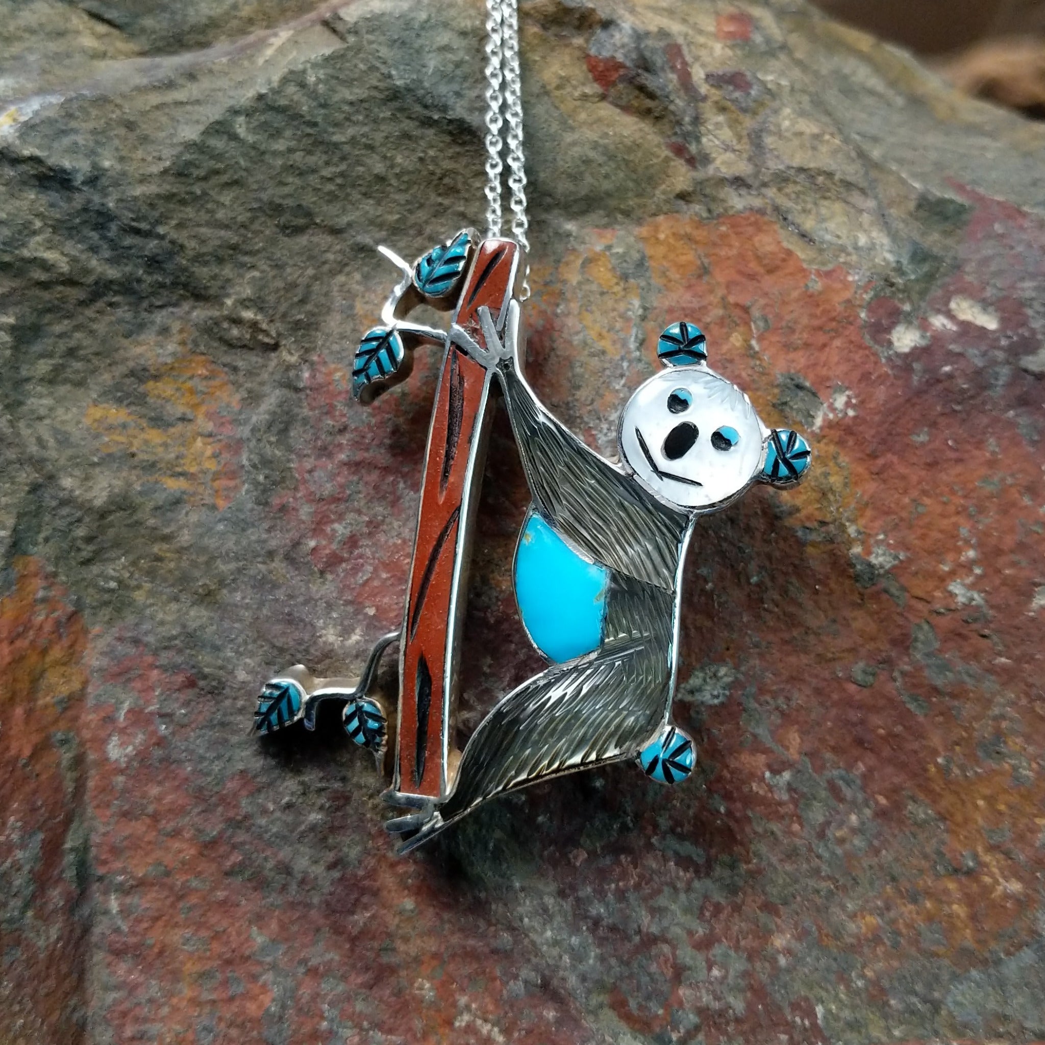 Handcrafted sterling silver koala pin and pendant by Valerie Comozona, featuring detailed inlay and a convertible pin-to-pendant design.